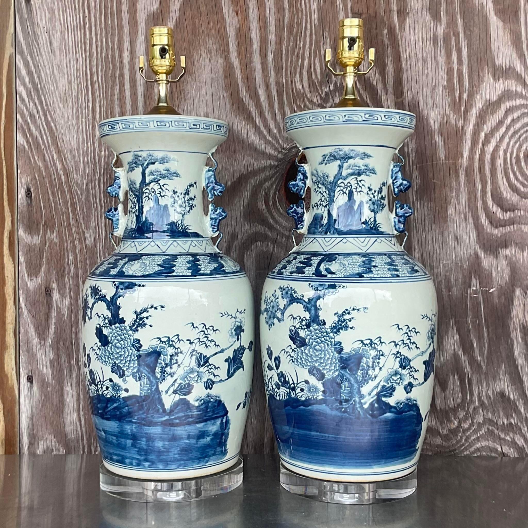 A gorgeous pair of vintage Asian table lamps. The classic gourd vase in an iconic pastoral design. Newly refurbished with all new wiring and hardware. Acquired from a Palm Beach estate.
