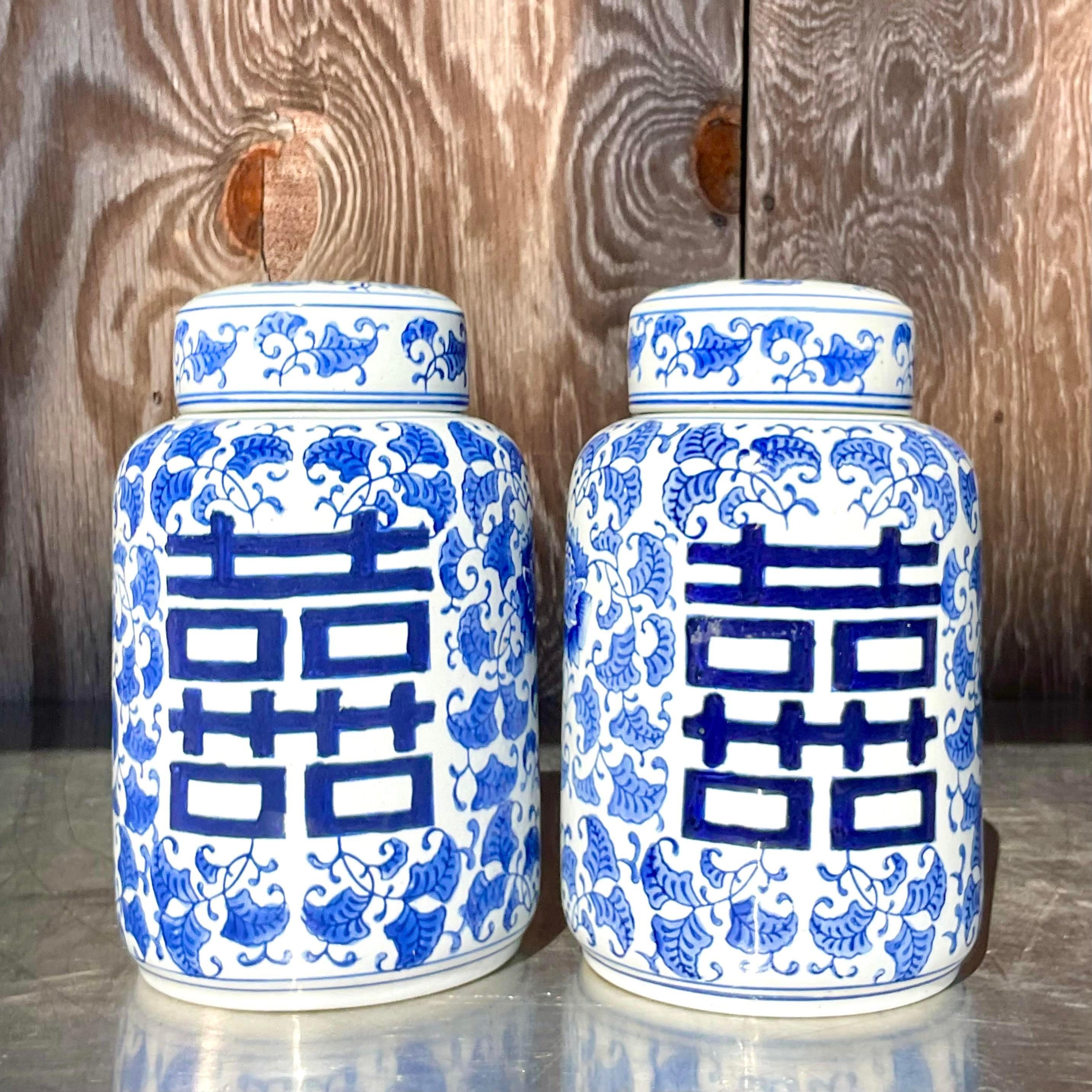 Vintage Asian Blue and White Lidded Urns - a Pair In Good Condition For Sale In west palm beach, FL