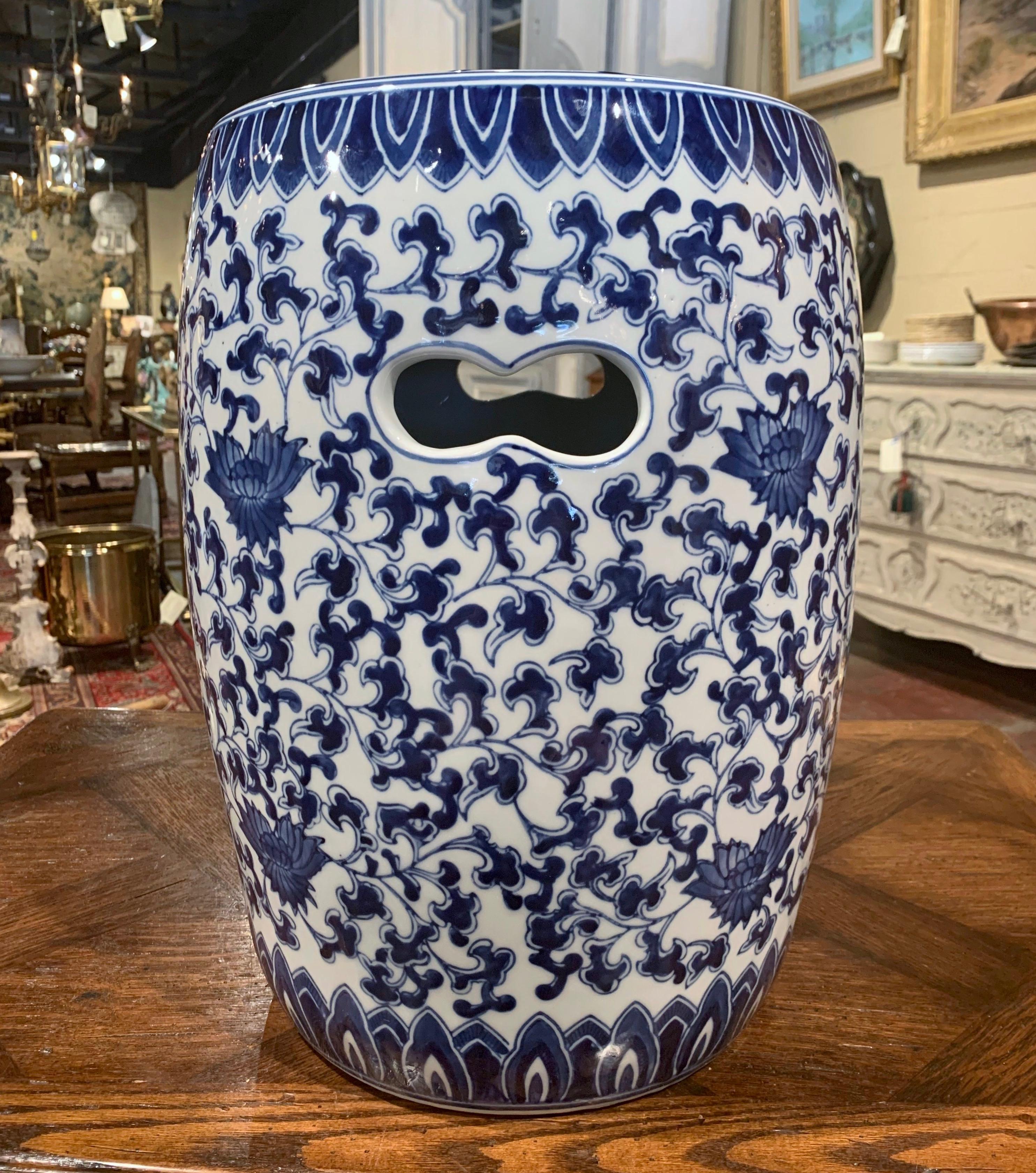 Bring extra seating to a den or a living room with this colorful vintage garden stool. Created in China, circa 1980 and round in shape, the porcelain seat is pierced on the top and around the perimeter, and is decorated with hand painted blue and