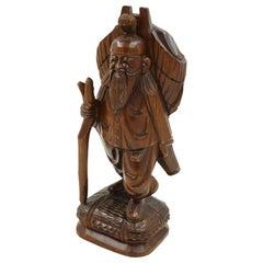 Vintage Asian Carved Figure of a Man with Pack and Walking Stick