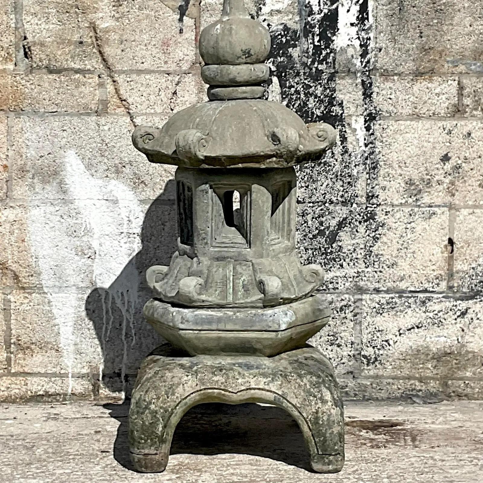 Fabulous vintage cast cement pagoda. Beautiful patina from time on this stunning outdoor sculpture. Breaks apart into stacking pieces for easy movement. Acquired from a Palm Beach estate