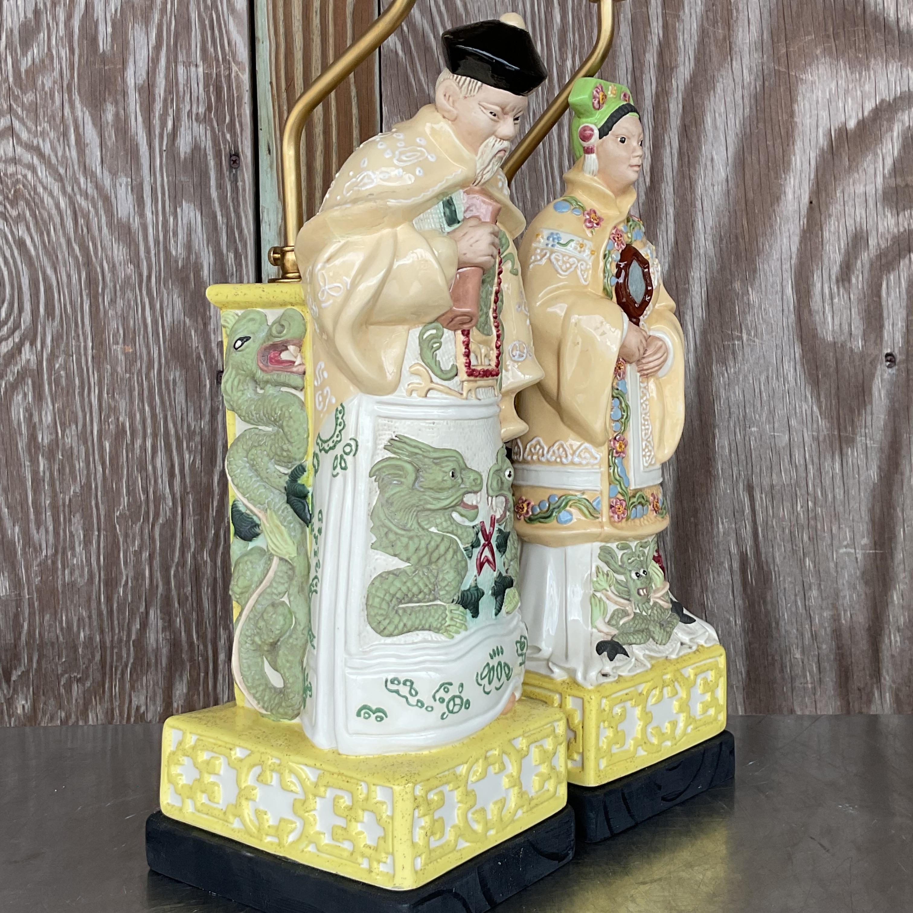 Illuminate your space with the regal elegance of this vintage pair of Asian Emperor lamps. Featuring intricately detailed figures of emperors, these lamps exude a sense of history and cultural richness. Perfect for adding a touch of sophistication