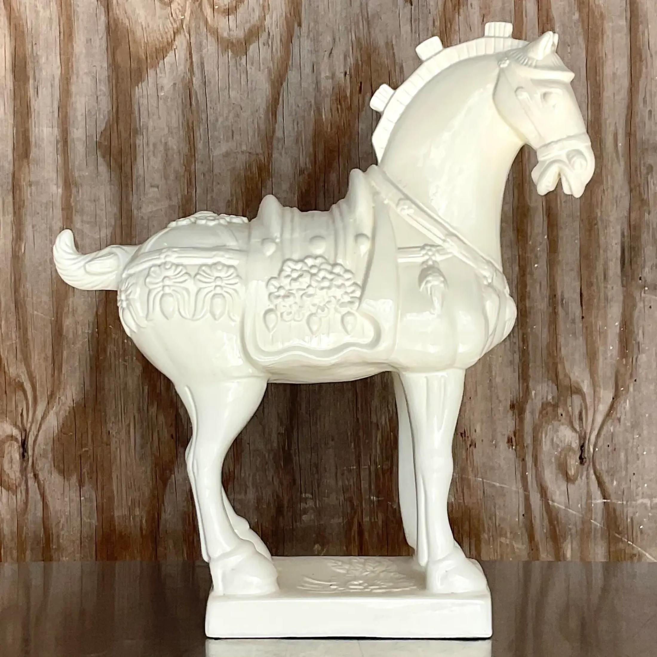 A fabulous vintage Asian glazed ceramic horse. Done in the style of the Tang Dynasty. Beautiful glossy off white finish. Acquired from a Palm Beach estate