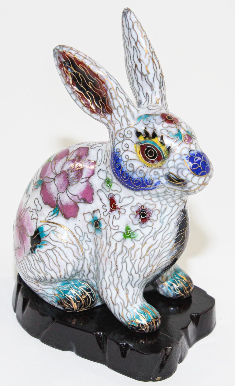 Vintage Chinese cloisonné white rabbit figurine sculpture on black stand.
Large vintage rabbit, hand Painted enamel and elegantly designed by an artist by hand. 
This beautiful piece features a lot of intricate detail and exquisite artistry.
 It