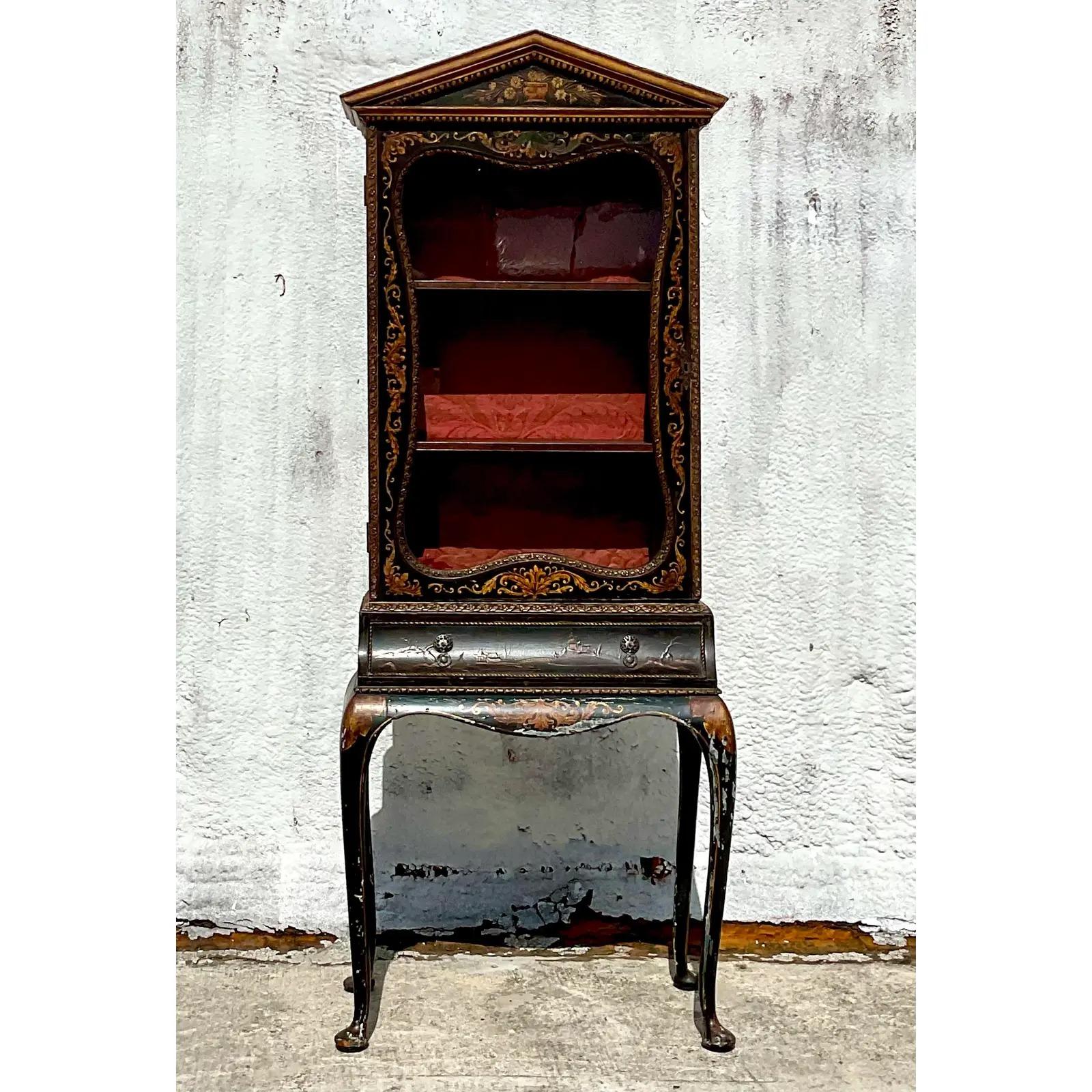 A stunning vintage Asian display cabinet. Beautiful hand painted Chinoiserie detail with a chic velvet lining. Perfect to display your small treasured collections. Acquired from a Palm Beach estate.