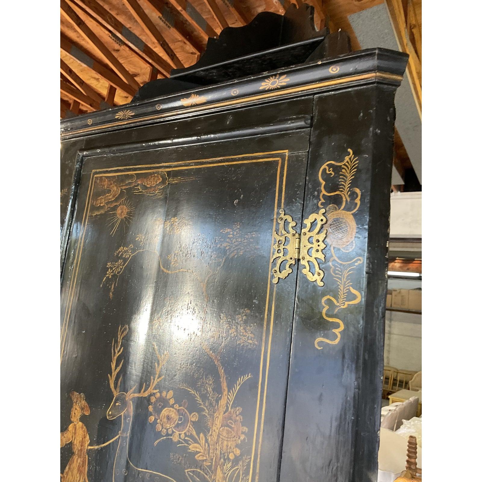 Incredible vintage Chinoiserie corner cabinet. Beautiful gold pastoral scenes on a glassy black background. Easily hung on the wall or also gorgeous just resting on a table top. Super chic. Acquired from a Palm Beach estate.