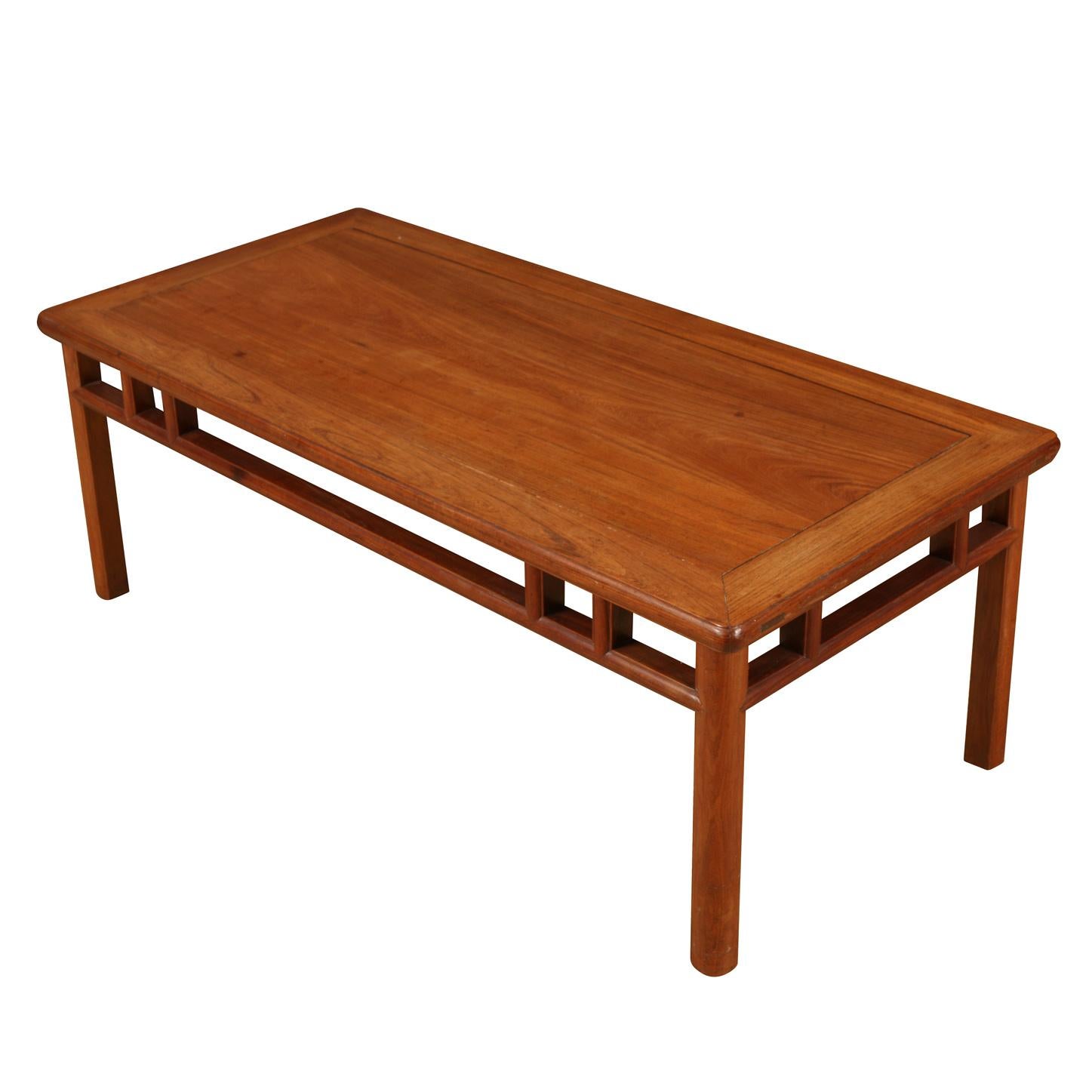 Vintage wood coffee table in Asian style with grid detail to apron.