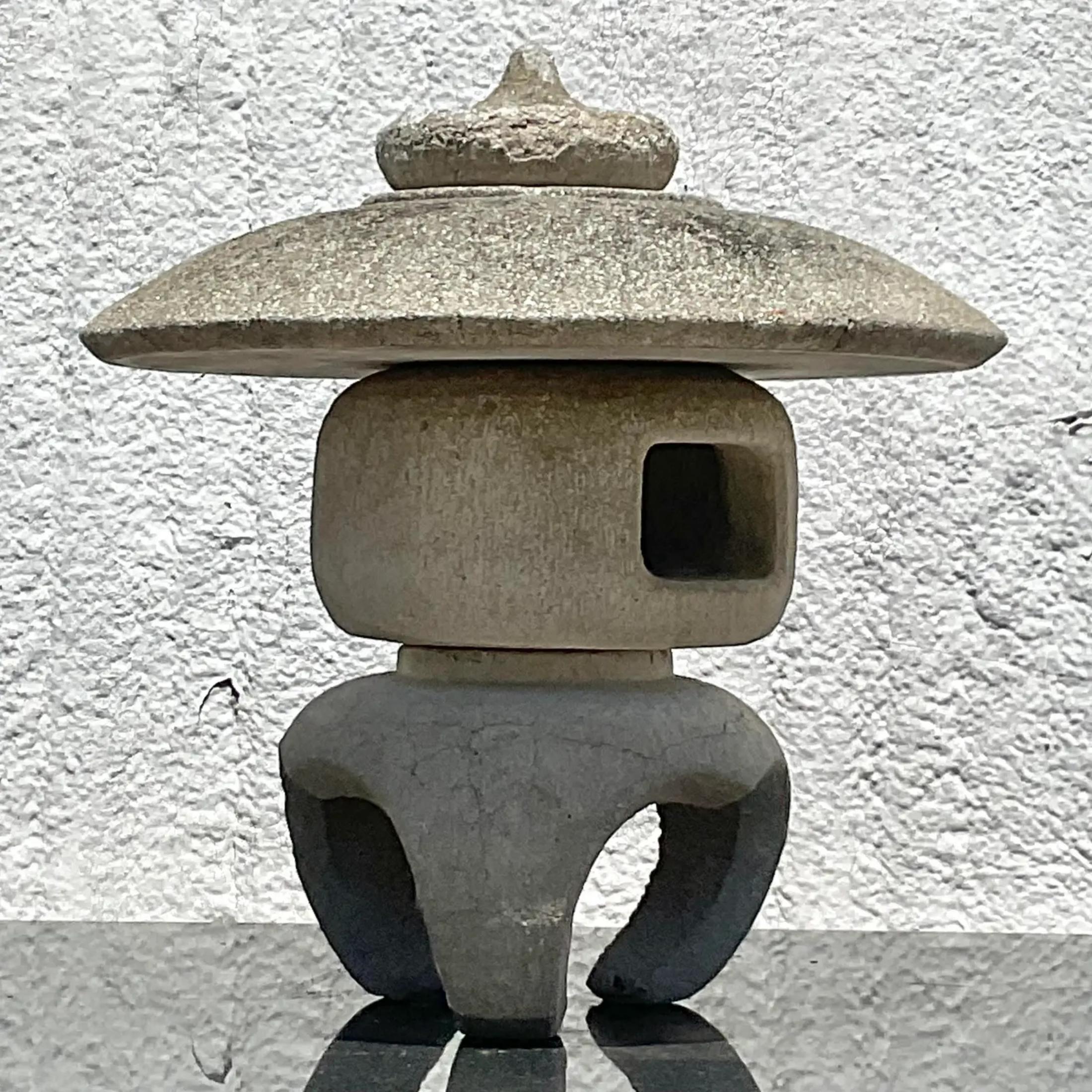 A fantastic vintage concrete garden ornament. A chic Asian pagoda in a clean and sleek design. Splits into 4 separate pieces for easy movement. Acquired from a Palm Beach estate