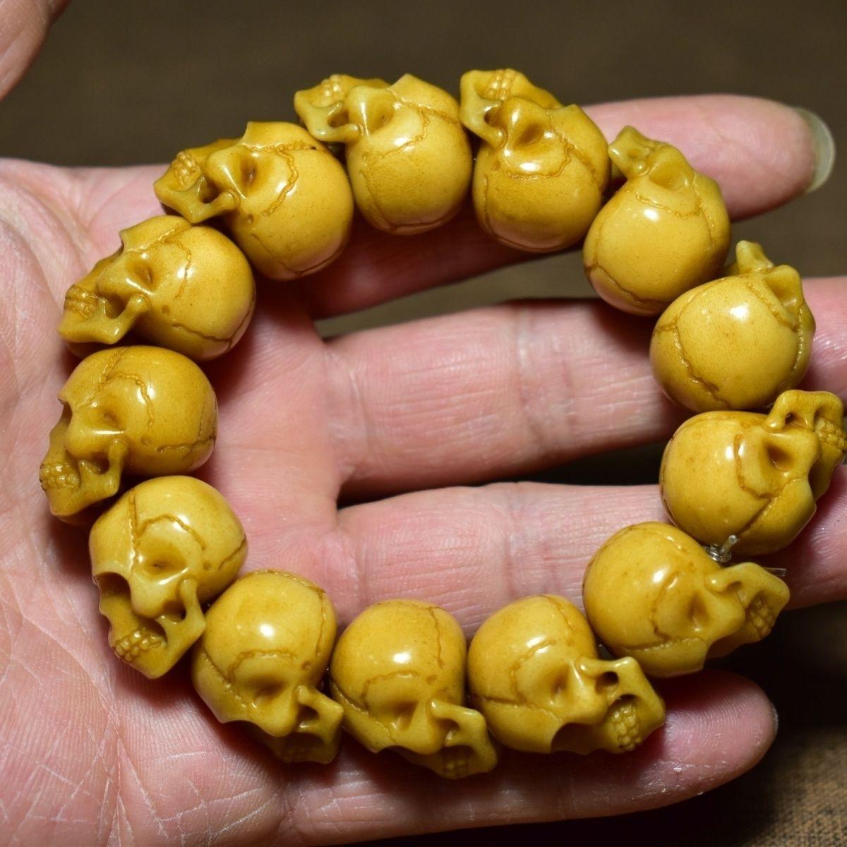 This Vintage Deer Horns Carving Bracelet is a striking and meaningful piece featuring hand-carved human skull beads, crafted from natural deer antler. Symbolizing impermanence, wisdom, and spiritual awareness, the skull motif is deeply rooted in