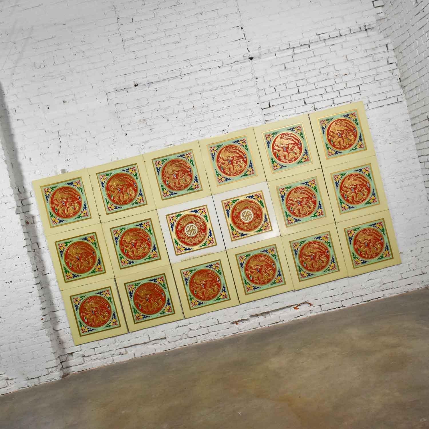 Gorgeous set of 18 vintage Asian drop ceiling panels. They are 2 x 2 ft. lauan wood squares, ¼ inch thick. 16 yellow with dragon design and 2 white with dragon and symbol design, hand painted and gilded, in beautiful condition with wear as you would