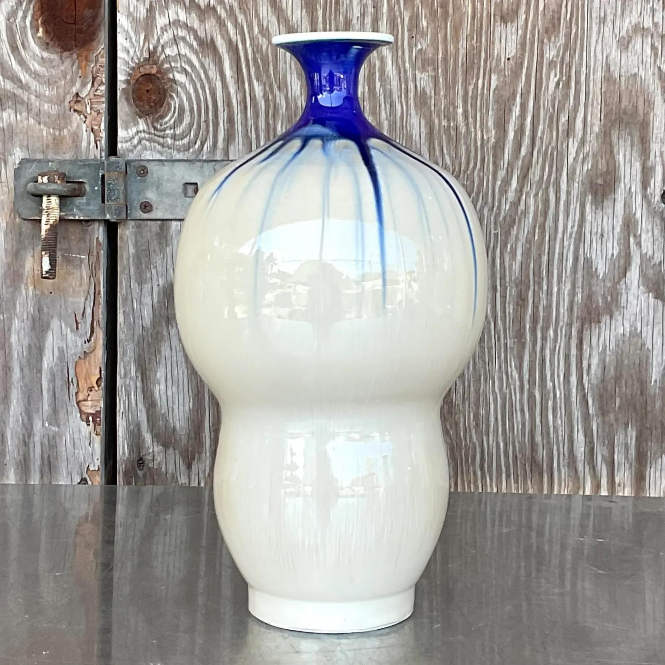 A fabulous vintage Asian vase. A chic little gourd lamp with a contemporary blue and white glaze. A great way to add a little flash of modernity to Thr any blue and white collection. Acquired from a Palm Beach estate