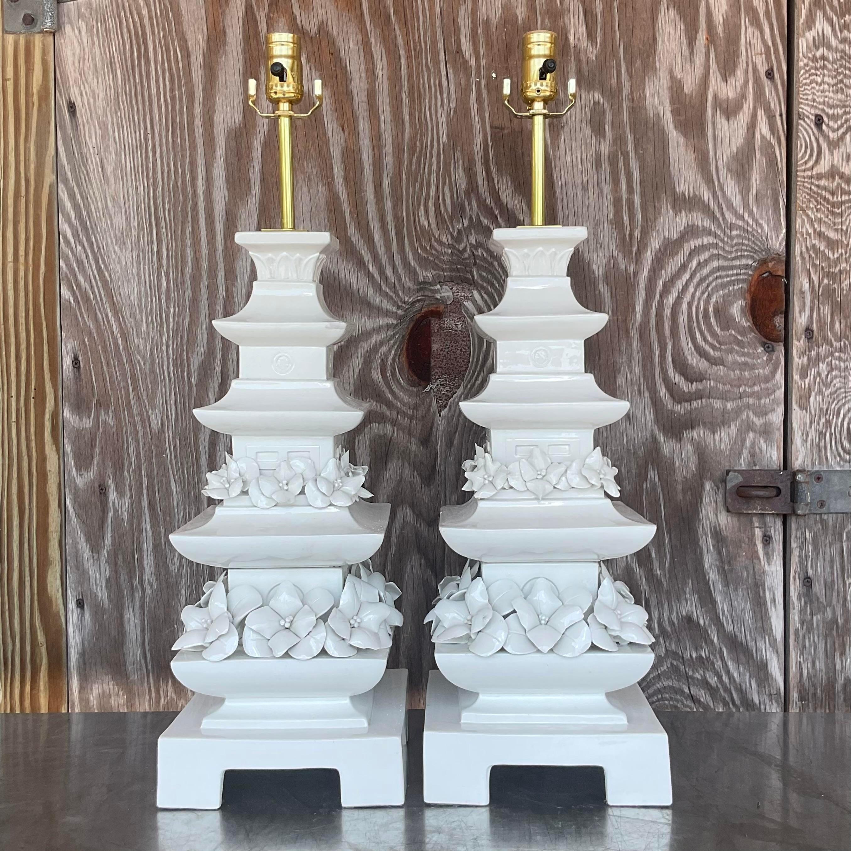 A fabulous pair of vintage Asian table lamps. A chic original glazed ceramic finish in a classic Pagoda shape. Fully restored with all new hardware and wiring. Acquired from a Palm Beach estate.