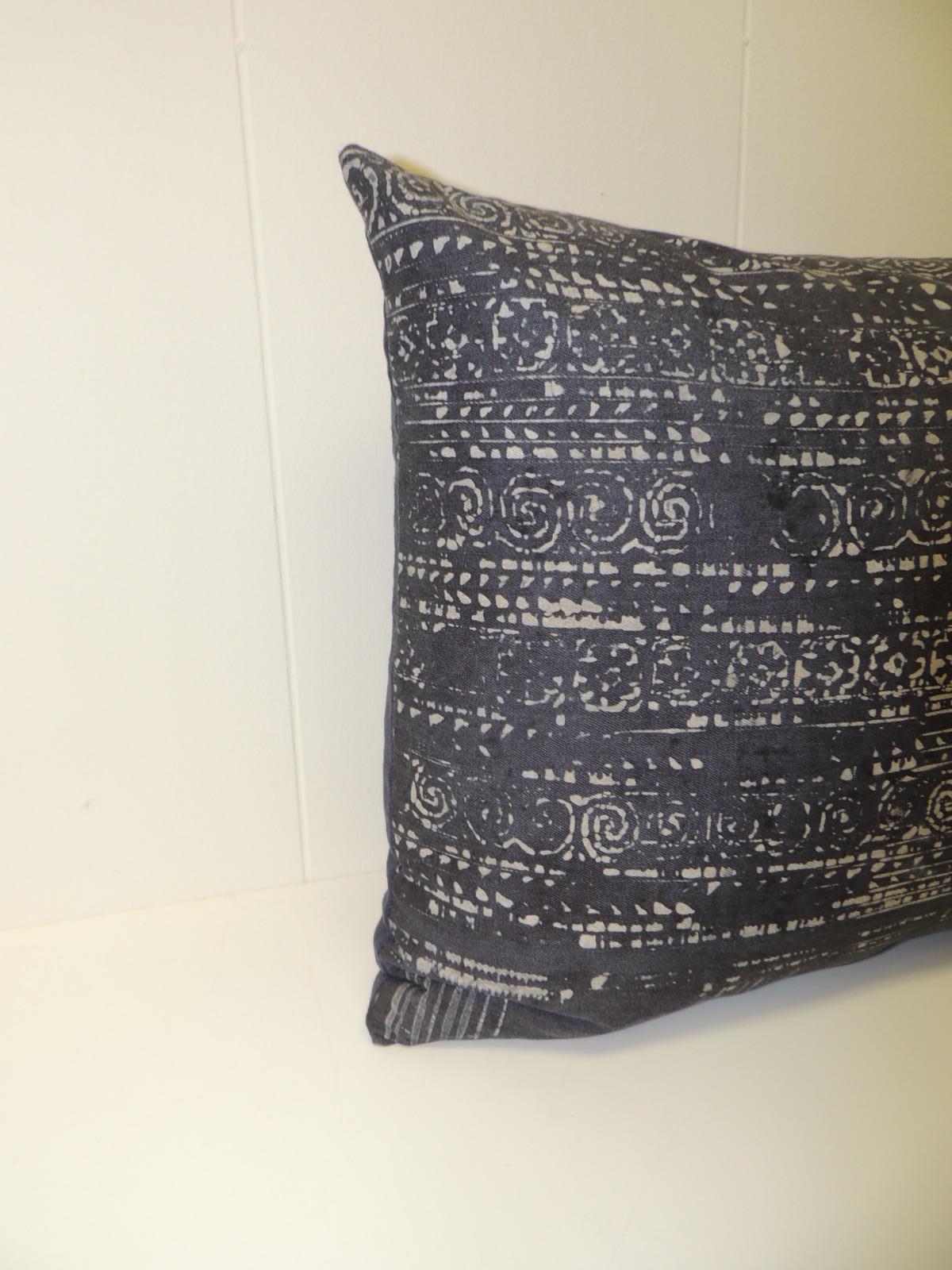 Vintage hand blocked batik decorative bolster pillow. Decorative lumbar pillow handmade with a hand-blocked indigo and white tribal patterns on the vintage textile. Decorative cushions finished with deep blue linen backing. Throw vintage pillow