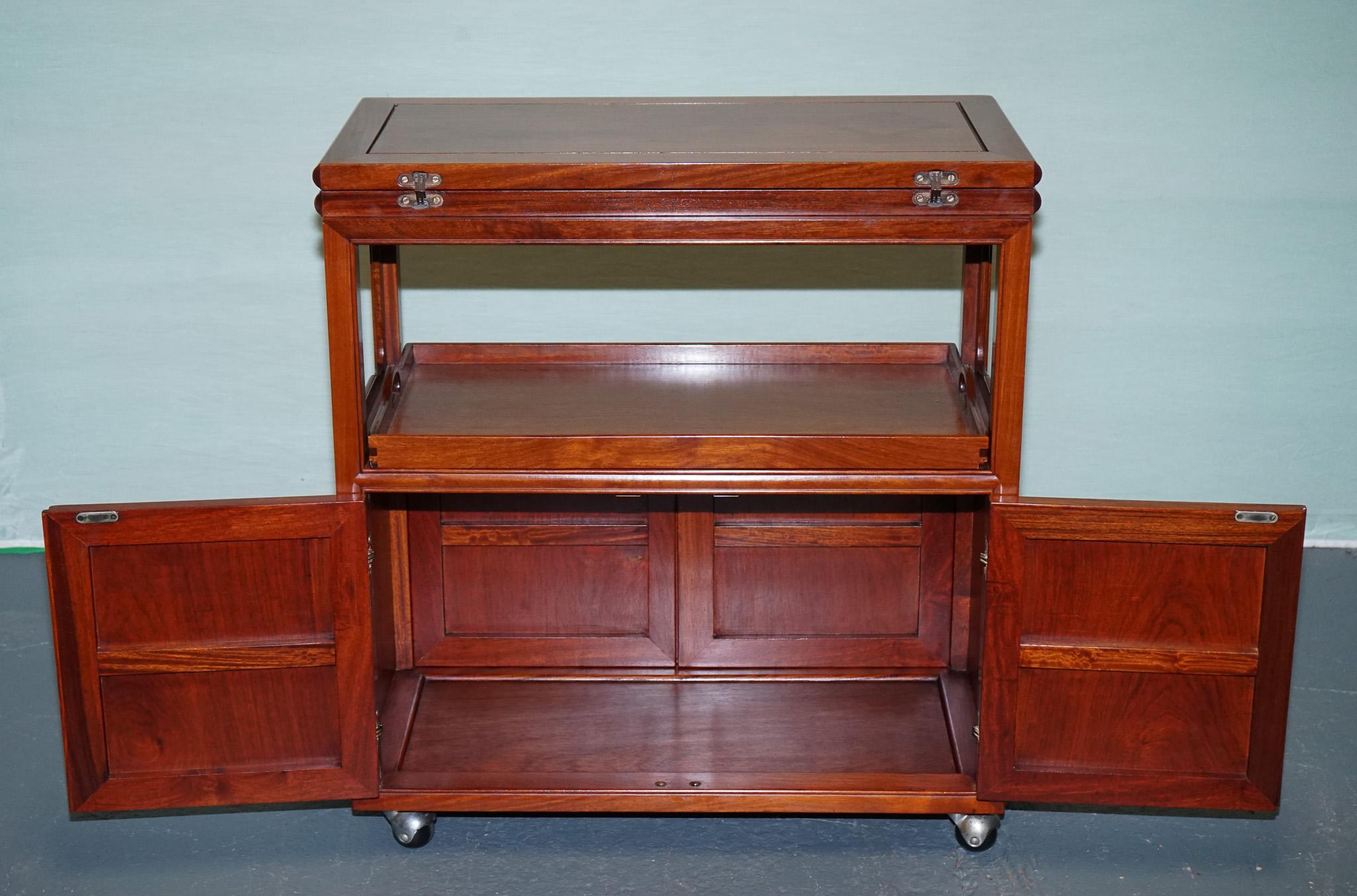 Hardwood VINTAGE ASIAN iNSPIRED ROLLING BAR CABINET MID CENTURY TEA OR LIQUOR CART For Sale
