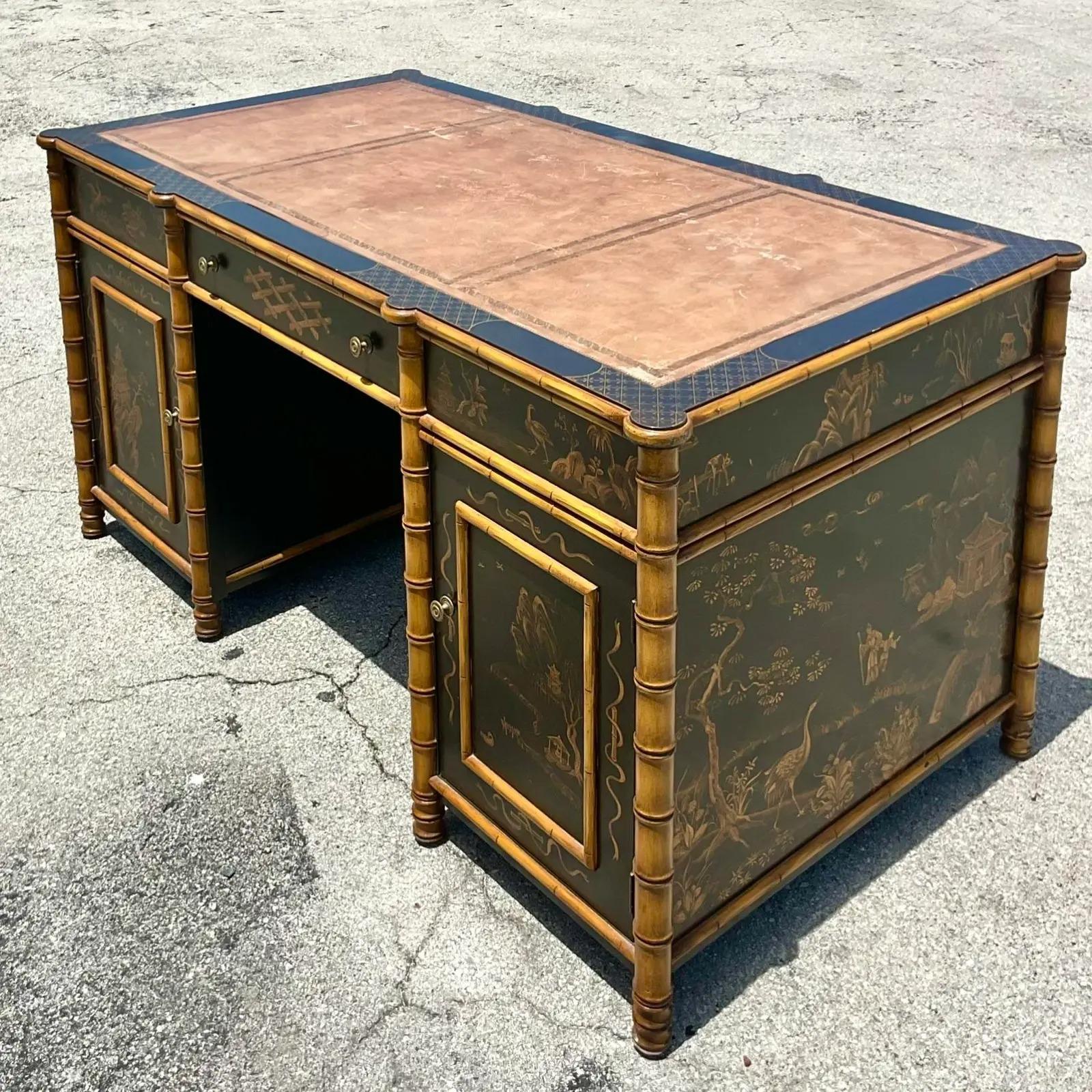 A fantastic vintage Asian partners desk. Made by the iconic Julia Gray group. A gorgeous hand painted Chinoiserie design in blacks and golds. All drawers operable on one side and the reverse is open cabinets and no drawers. Stunning from all sides