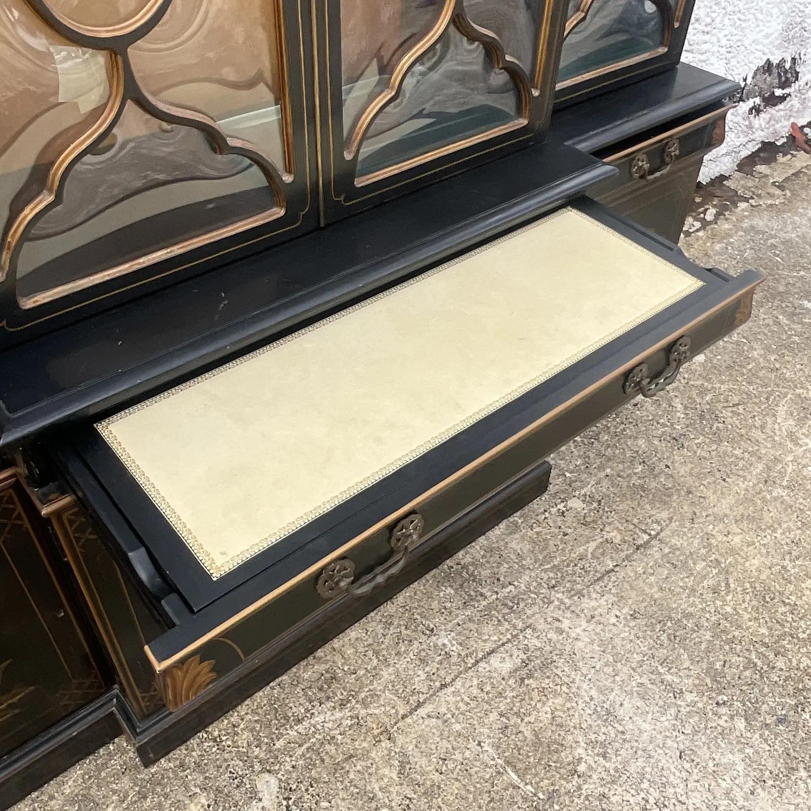 Stunning vintage Karges China cabinet. A beautiful black lacquer with classic Asian pastoral hand painted scenes. Spectacular Crown glass doors for extra glamour. Pull out drawer with leather top. Lifts to reveal extra storage below. Perfect for