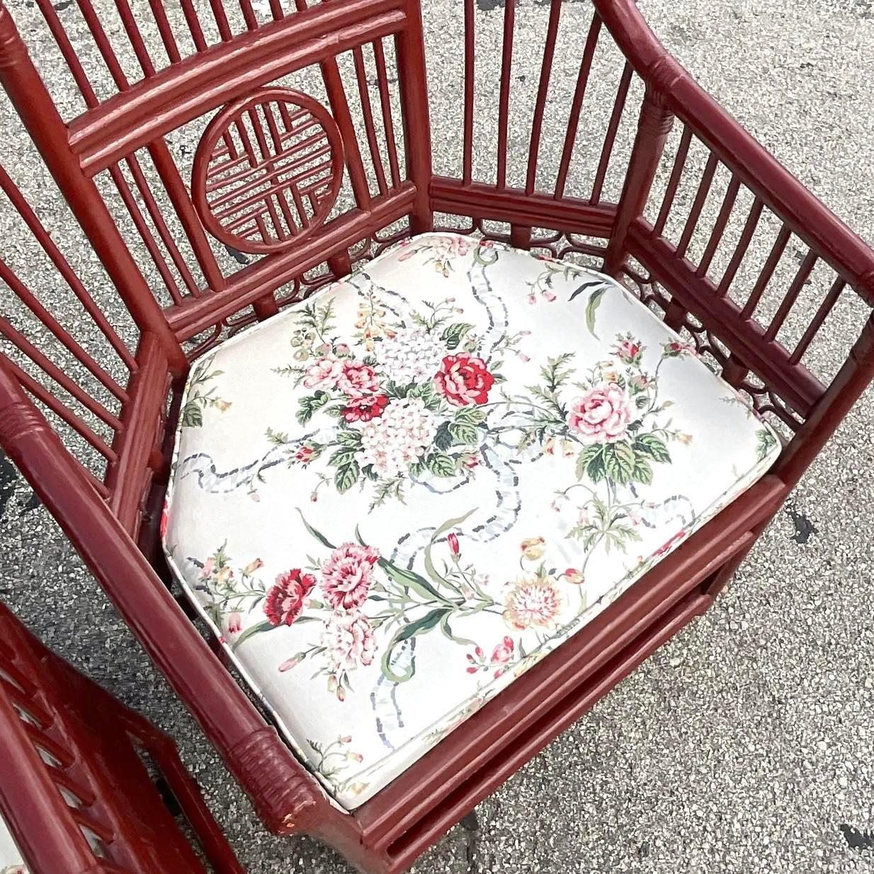 This pair of vintage Asian-inspired Brighton chairs is a stunning example of lacquered rattan artistry, featuring intricate medallion backrests and a refined silhouette. The black lacquer finish adds a touch of elegance, while the woven rattan
