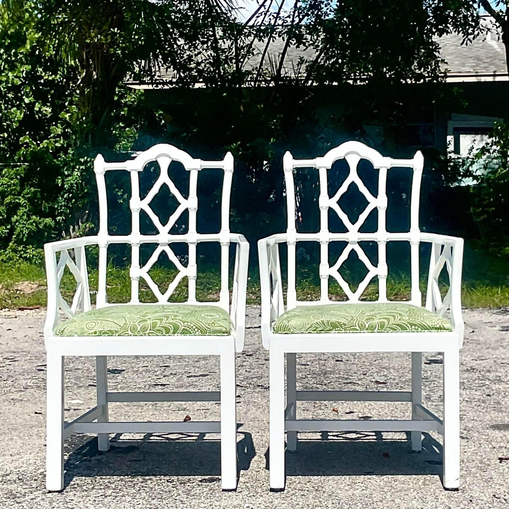 A fabulous pair of vintage Boho dining chairs. A chic pair of lacquered Asian pagoda chair. A brilliant green upholstered seat. Acquired from a Palm Beach estate.