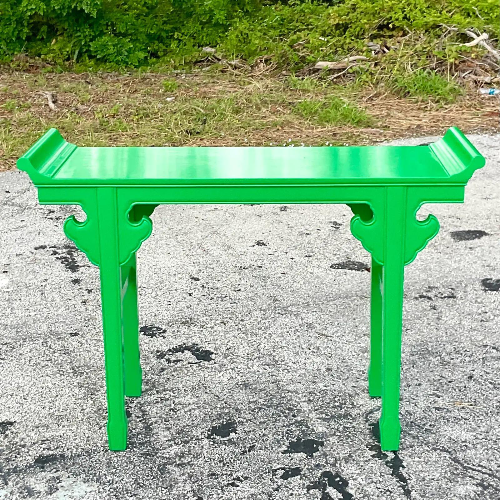A fantastic vintage Asian console table. A brilliant Kelly green sent I gloss lacquered finish on a classic pagoda design. Sure to add a flash of drama to any space. Acquired from a Palm Beach estate.