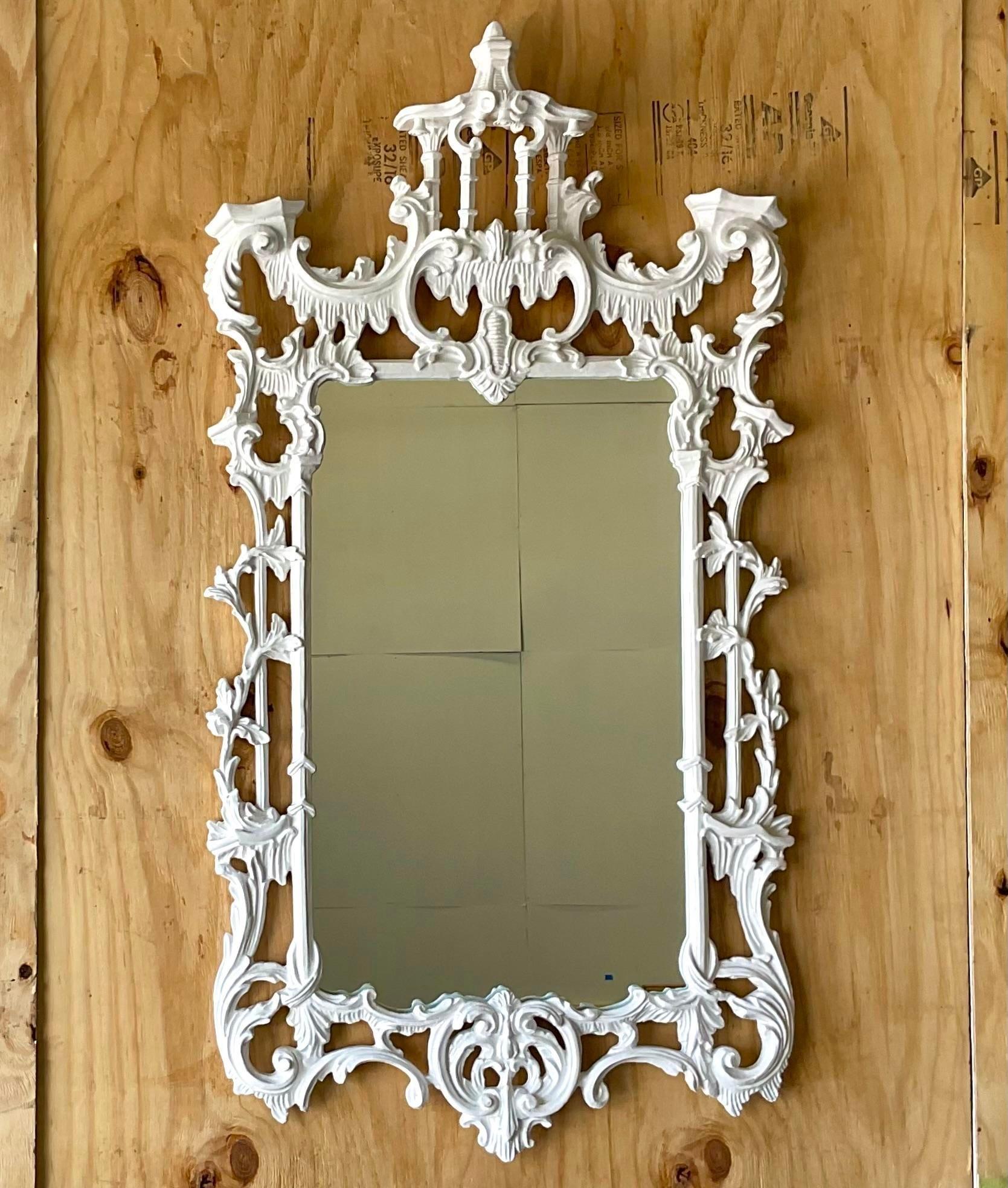 A fabulous vintage Asian wall mirror. The highly coveted Pagoda style in a high gloss white lacquered finish. Tall and impressive. Acquired from a Palm Beach estate. 