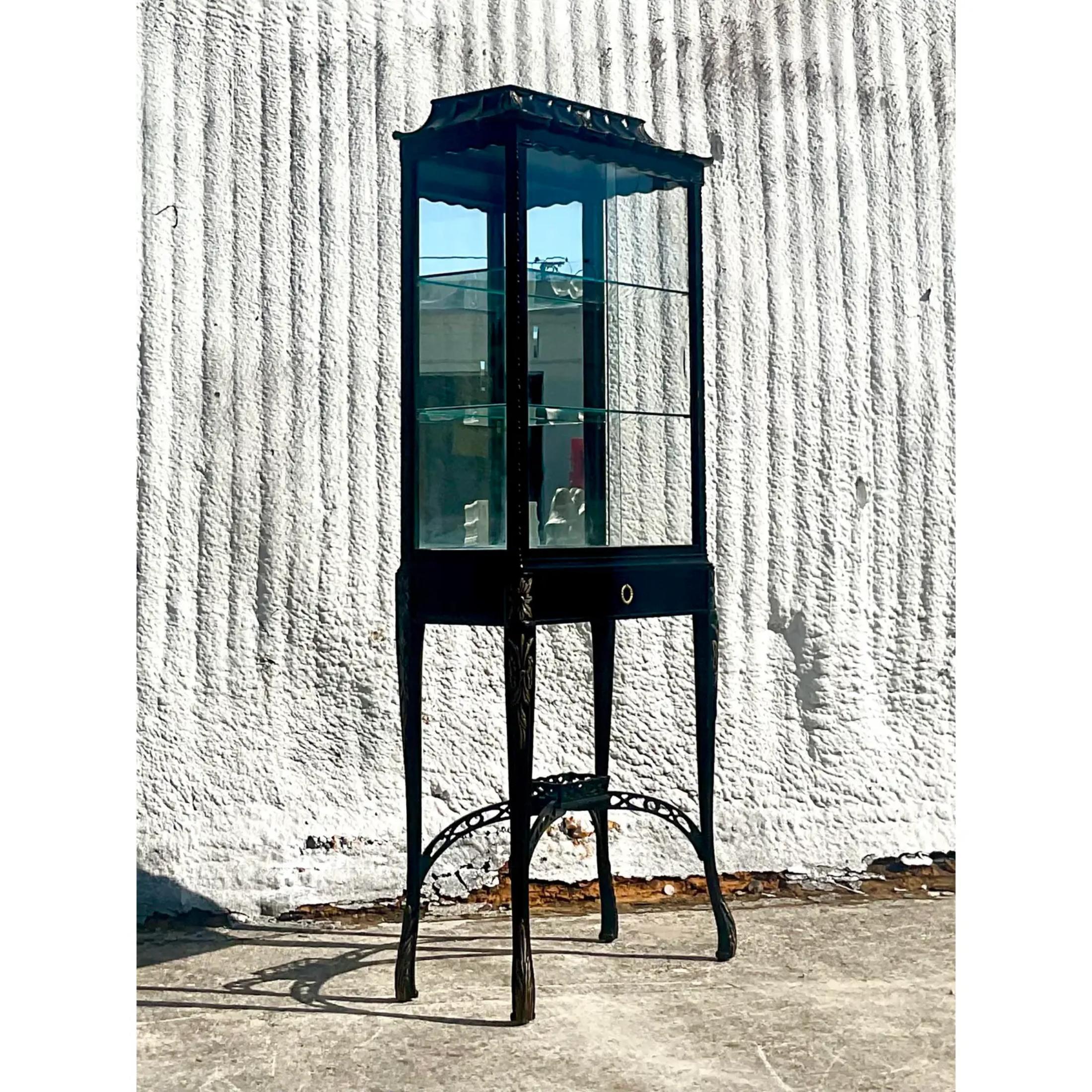 Incredible vintage Asian pagoda cabinet. Black lacquered cabinet with gold leaf flourishes. One drawer for your supplies. Tiffany blue velvet interior with glass shelves. Chic pagoda roofline. A really special piece that would add drama and glamour