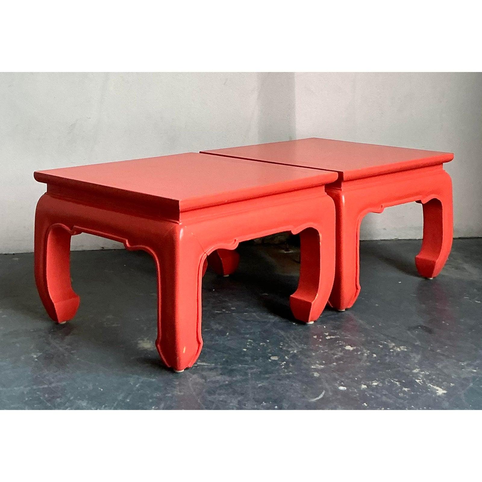 This chic pair of low side tables offers a vibrant fusion of traditional Asian design influence and bold, mid-century color application. Featuring classic Chippendale-style curved legs and apron detailing, the tables have been finished in a