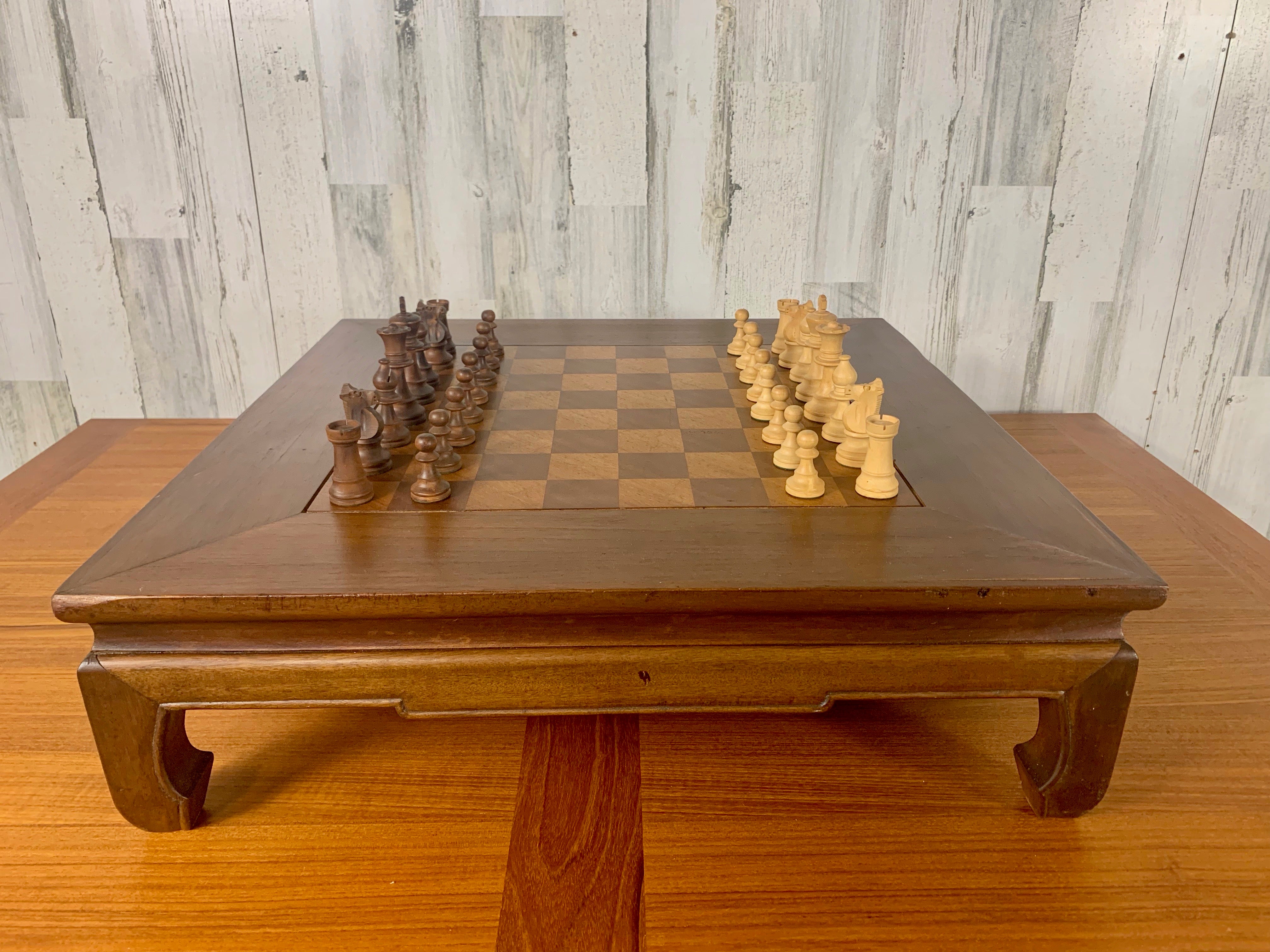Mid century Asian style Chess board with carved wood chess pieces and drawer for storage. This would be great on the floor with two big pillows.