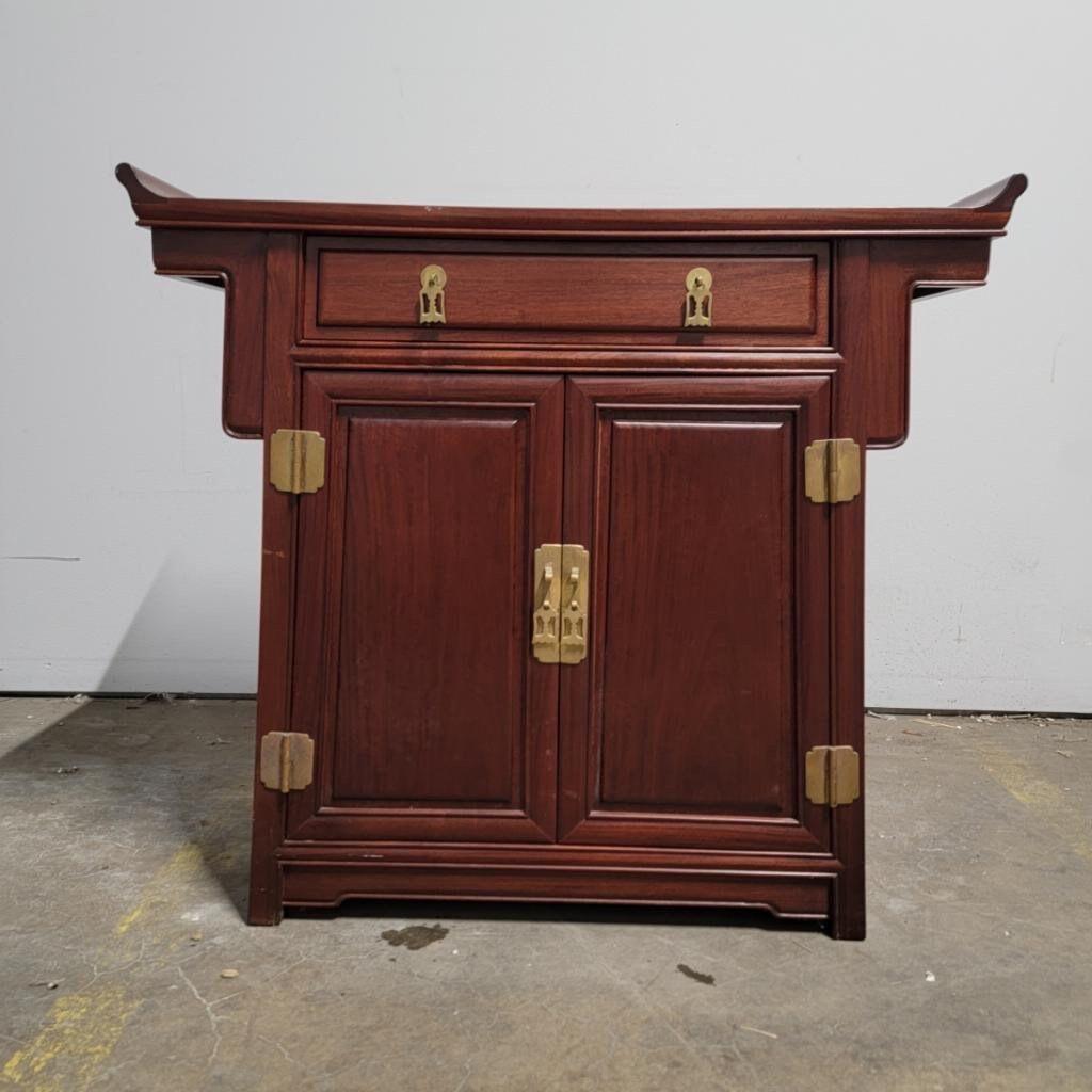 Vintage Asian Modern Pagoda Style Chinese rosewood altar storage chest

Gorgeous Asian Modern pagoda style Chinese rosewood single lined top drawer cabinet with 2 lower doors that open up to 3-lined drawers with brass hardware and rolled edge top.