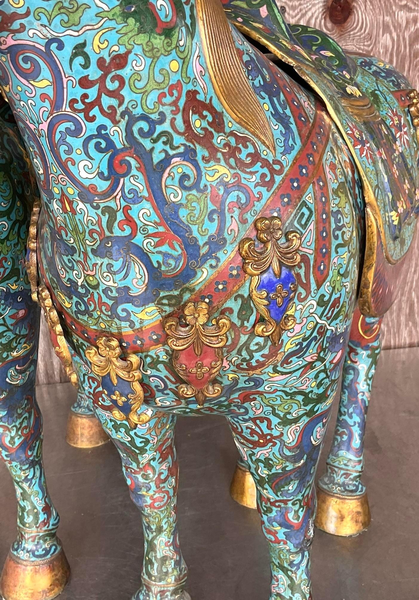 Introduce a touch of majestic allure to your space with our Vintage Asian Monumental Cloisonné Enameled Horses - A Pair. Crafted with intricate artistry and timeless elegance, these pieces embody the rich cultural heritage of Asia while seamlessly