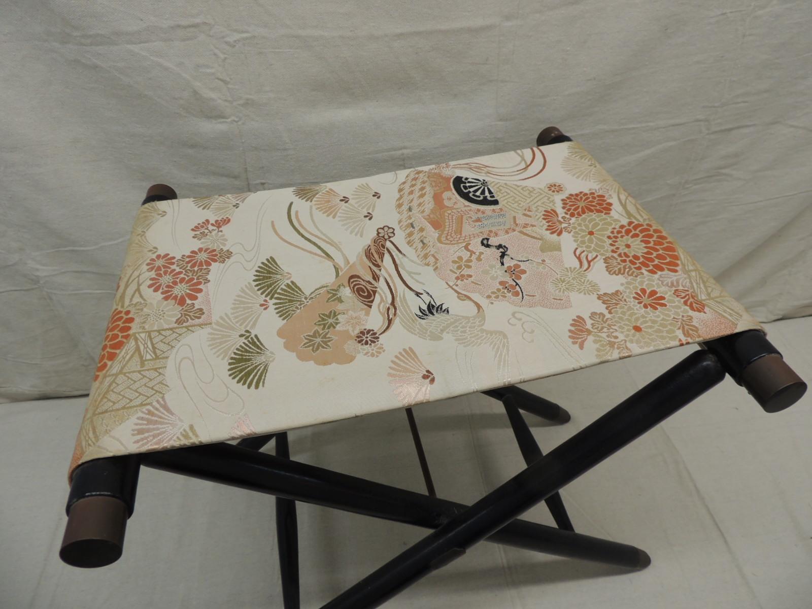 Asian Obi covered folding stool
Ebonized X base wood with bronze style hand covers and hardware.
Orange and pink floral silk Obi textile.
Could be use as a luggage rack too.
Size: 16 x 20 x 18.5 H.
  