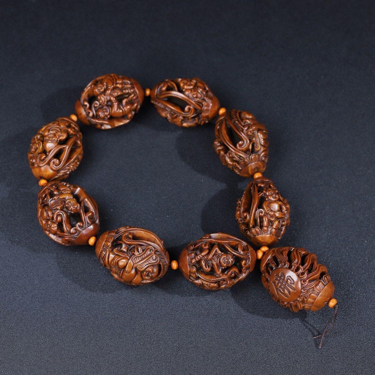 Vintage Asian Olive Nut Carving Beads Bracelet – Child Maitreya Buddha Design, Handcrafted Spiritual Jewelry

This Vintage Asian Bracelet is intricately handcrafted from natural olive nuts, each bead meticulously carved with the joyful image of the