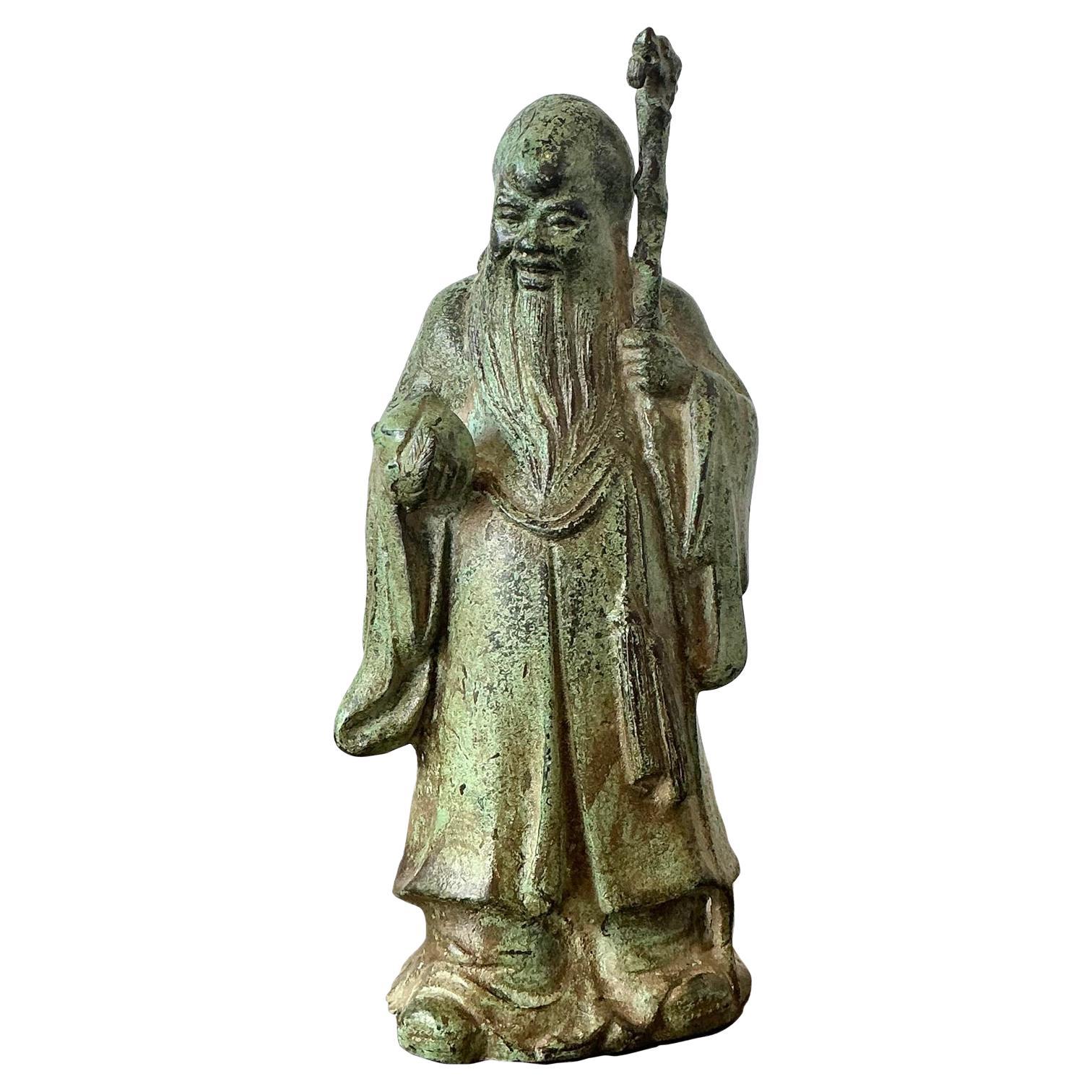 Personaggio asiatico d'epoca in bronzo patinato in vendita