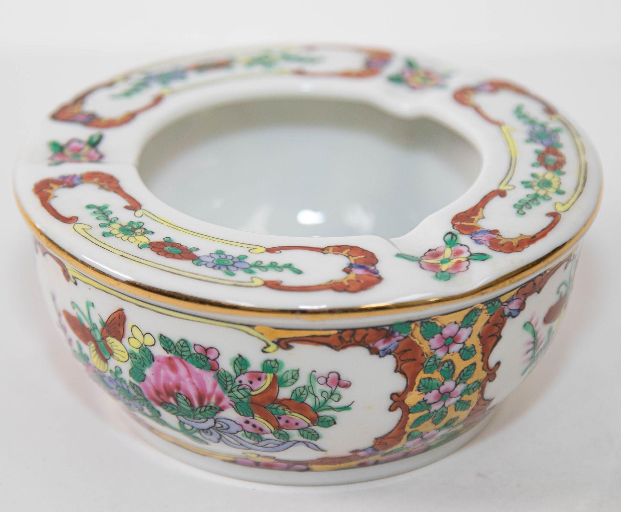 This vintage Asian porcelain hand painted floral ashtray was handmade in China.
This gorgeous gilded ashtray is intricately hand painted with Asian floral lotus decoration in gilt and geometric design on white background in blue, pink, red, green