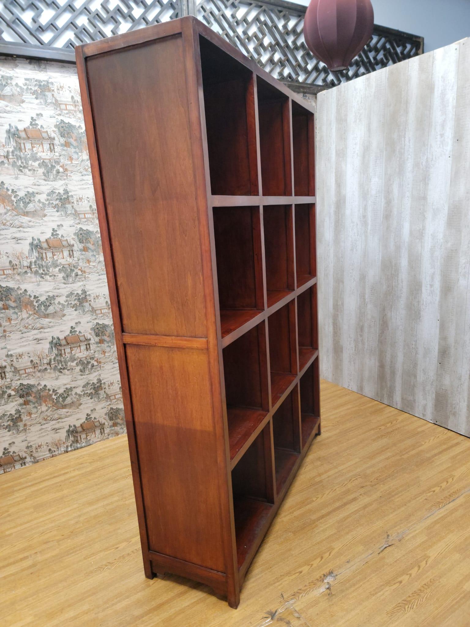 Vintage Chinese Red Lacquered Elmwood Cube Bookcase

This bookcase has 12 cubes and 3 shelves.

Circa: 1999

Dimensions:

W 59.5