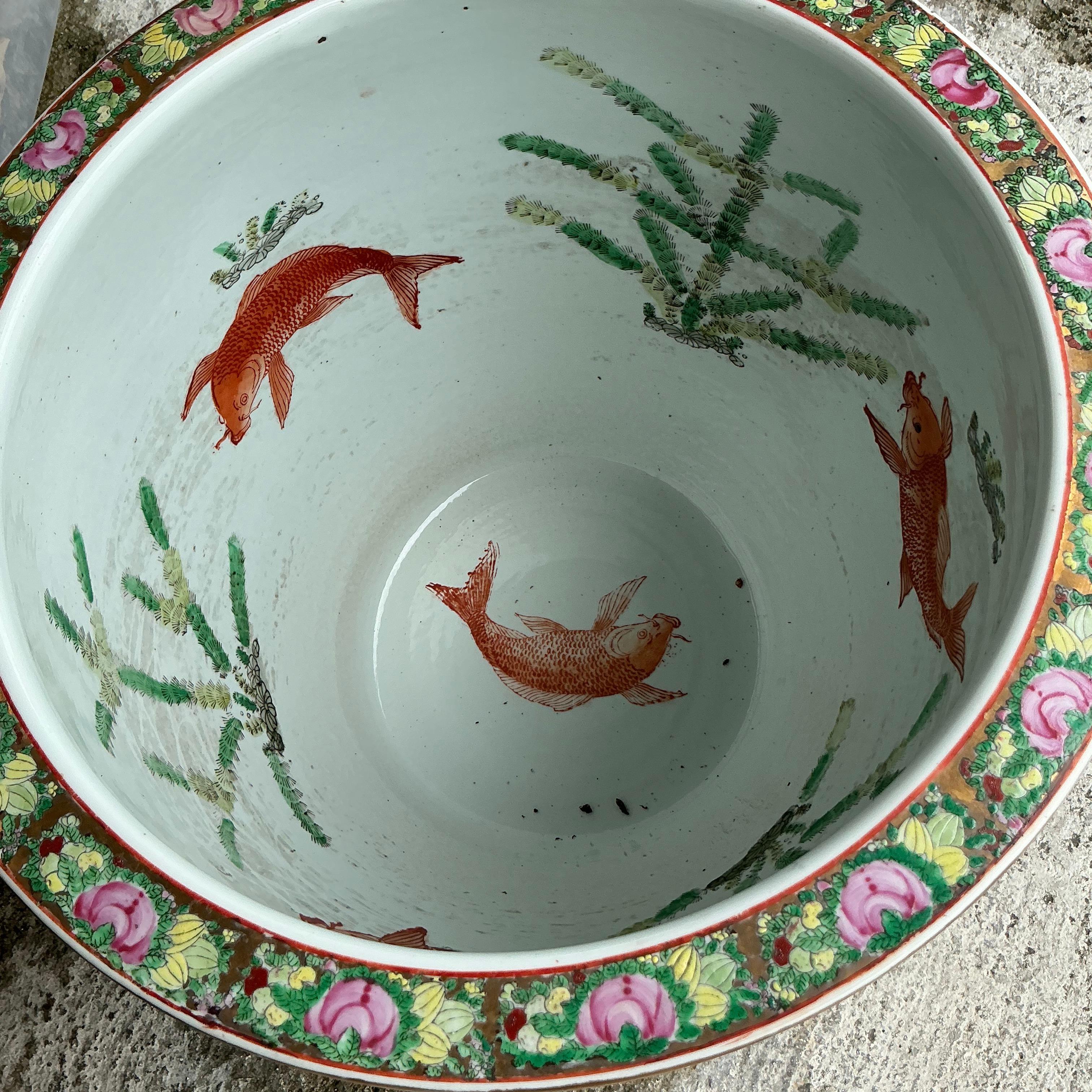 Add a touch of elegance to your space with this Vintage Asian Rose Famille Ceramic Planter. Hand-painted with intricate floral motifs and vibrant colors, this piece showcases the artistry of traditional Chinese porcelain. Perfect for showcasing your