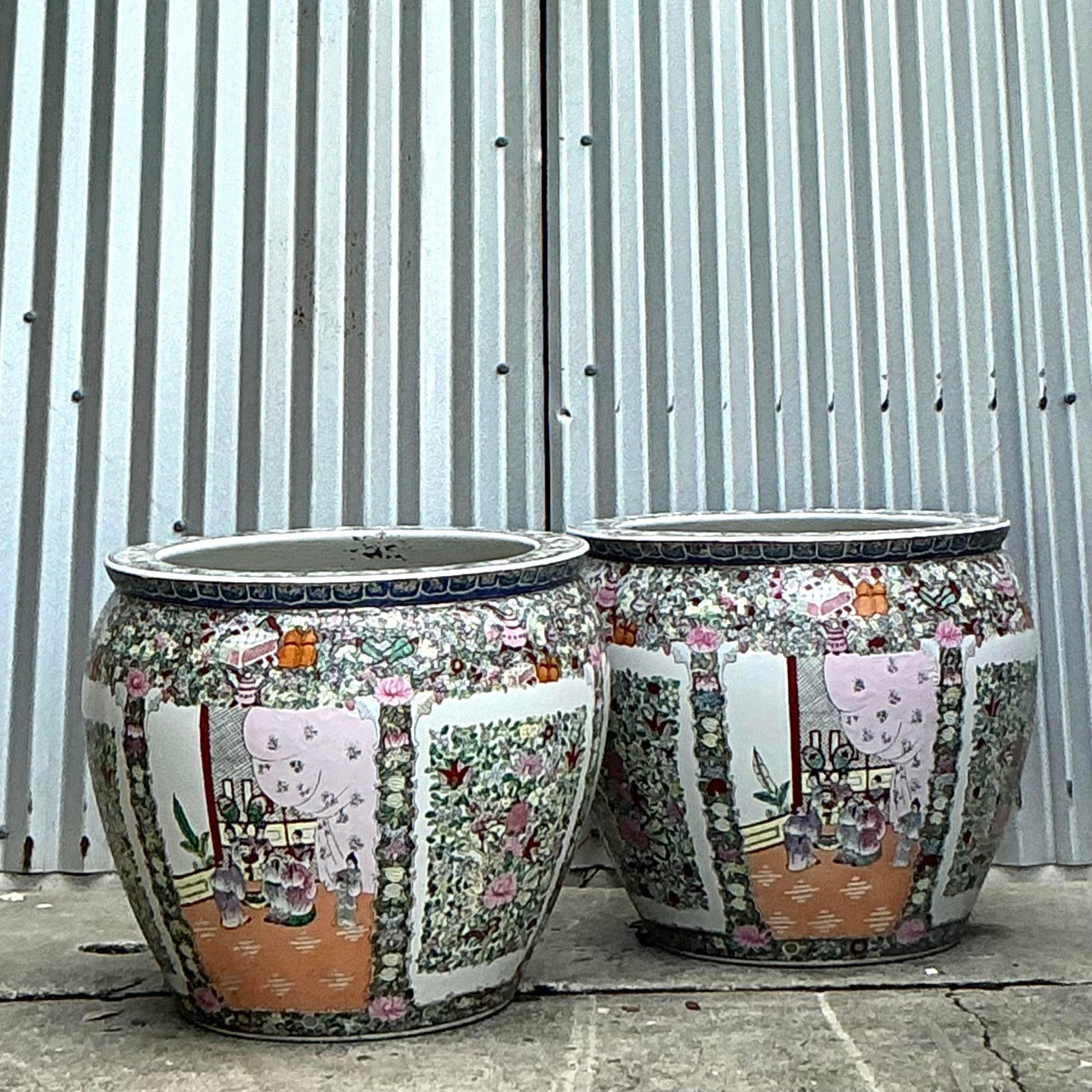 Infuse your home with timeless elegance through this exquisite pair of Vintage Asian Rose Medallion Jardinières. These beautifully crafted ceramic planters feature intricate hand-painted designs in the classic Rose Medallion style, showcasing