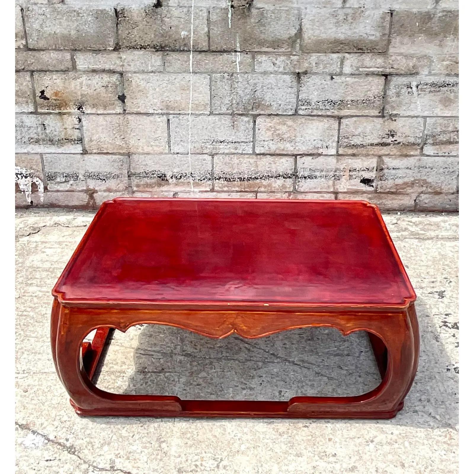 Fantastic vintage Asian coffee table. Made by the king of lacquered furniture Rae Kasian. Signed on the bottom. Beautiful iconic Ming shape in a brilliant cherry brown. Acquired from a Palm Beach estate.