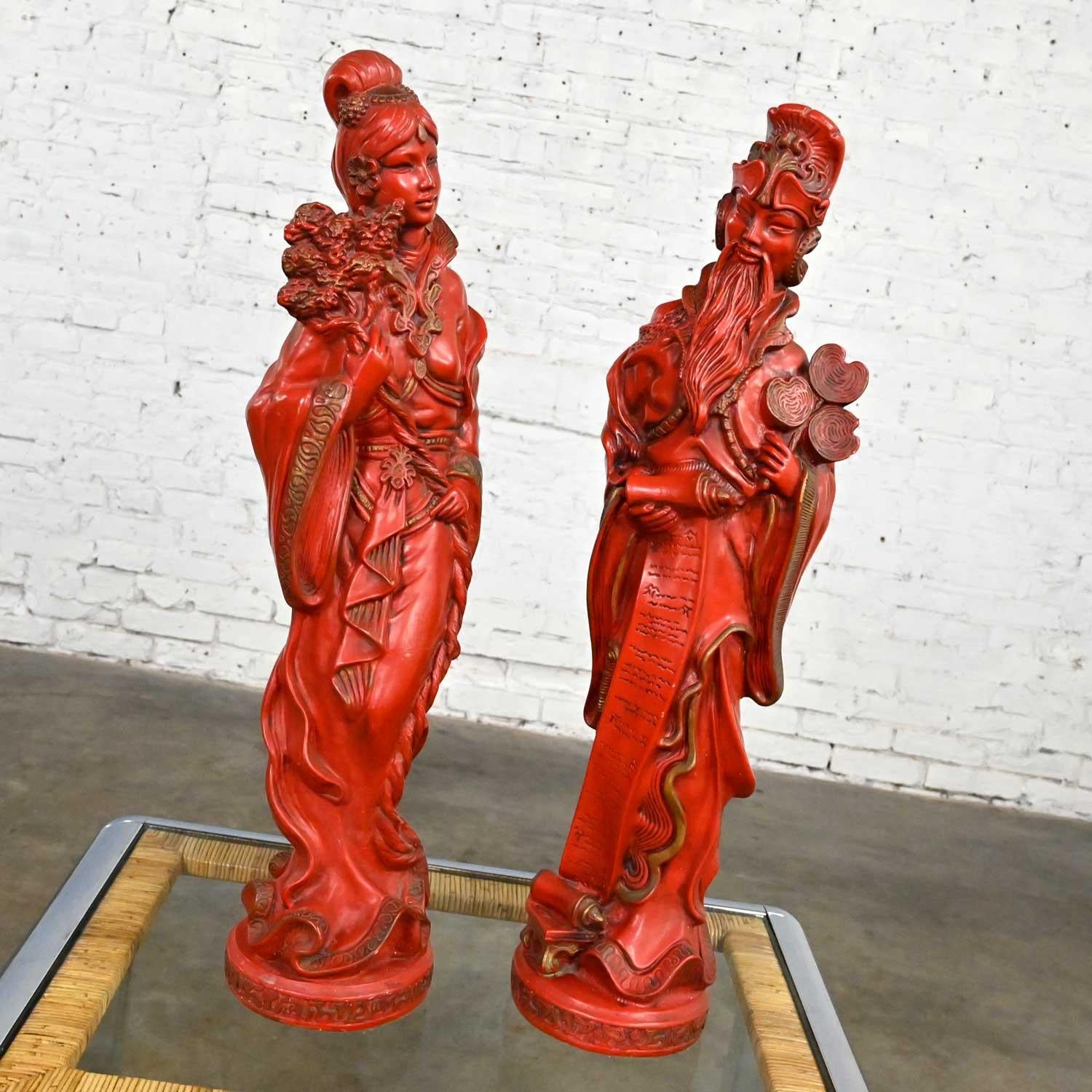 Breathtaking vintage Asian Style Chinoiserie large decorative statues 1 male and 1 female comprised of bright red plastic-coated plaster or “faux cinnabar.” Beautiful condition, keeping in mind that these are vintage and not new so will have signs