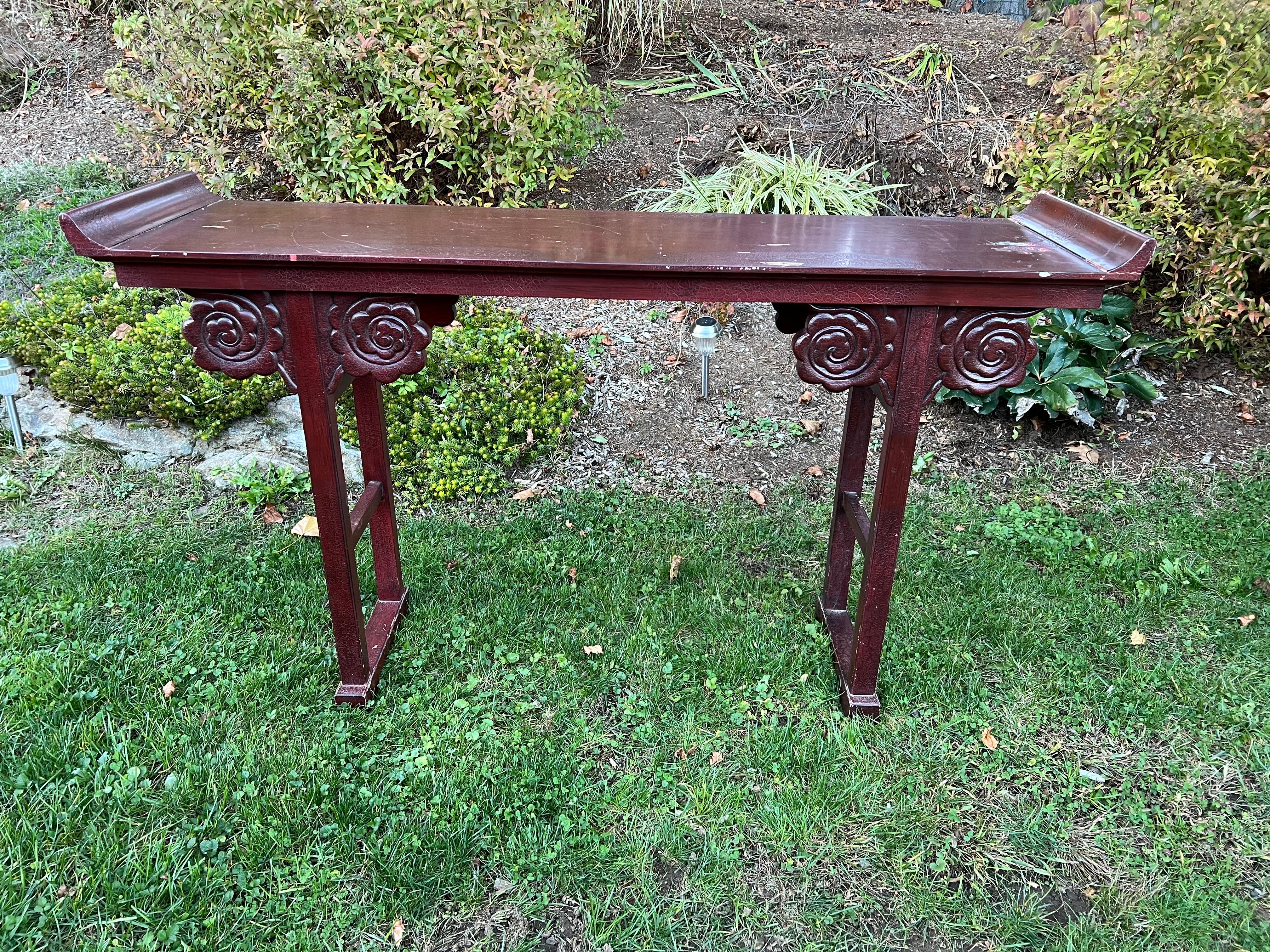 Vintage Asian Style Console Table. Decorative Altar table with embellished scrolls. Perfect for an entry way or as a sofa table. Solid wood. Needs a repaint. We were thinking fire engine red. Please confirm dimensions prior to purchase. 