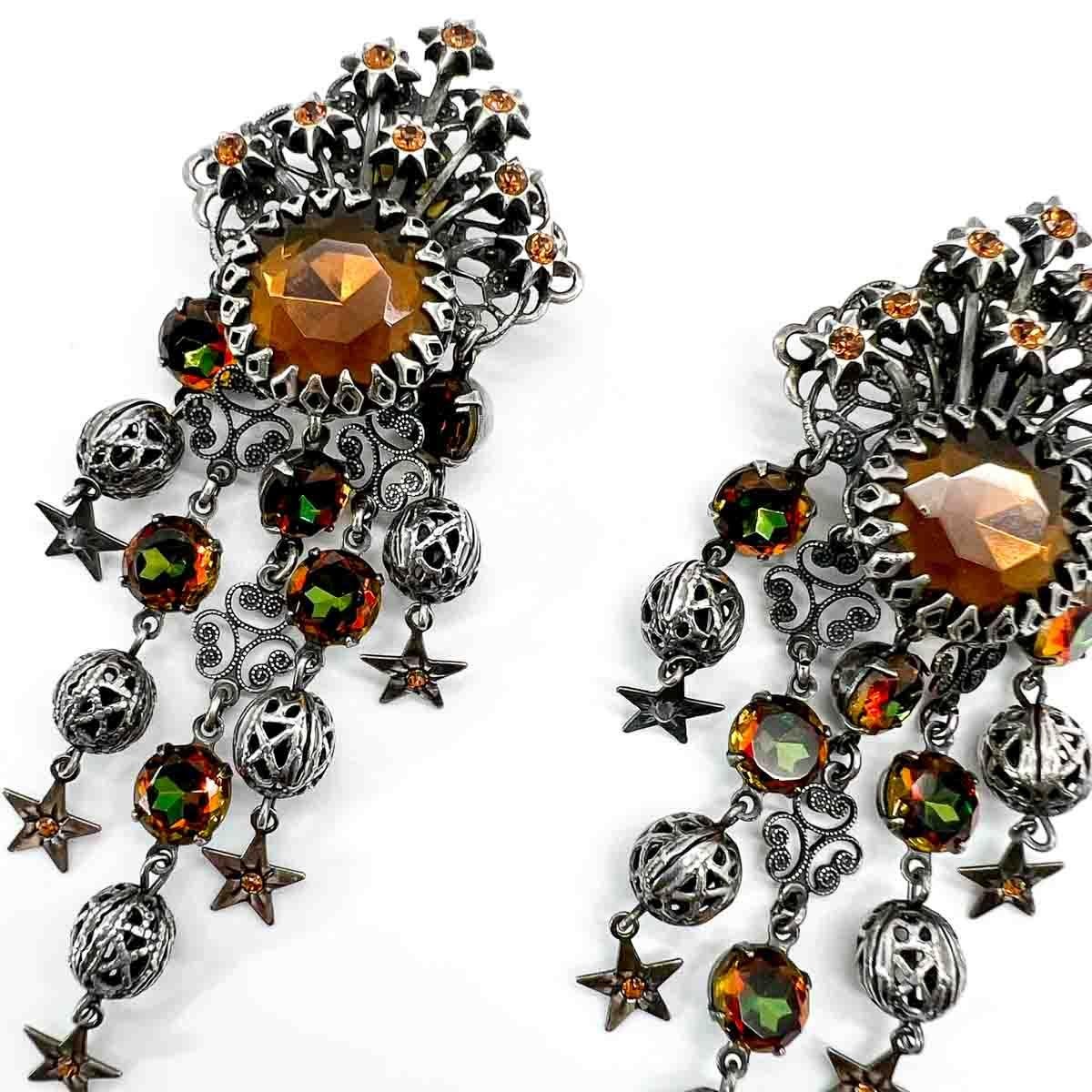 A spectacular pair of Vintage Askew Celestial Earrings. A work of wearable art to adorn your favourite looks.

Founded by Alice Cicolini, a former accessories editor for British Vogue in the late 1970s Askew London is famed for its elaborate,