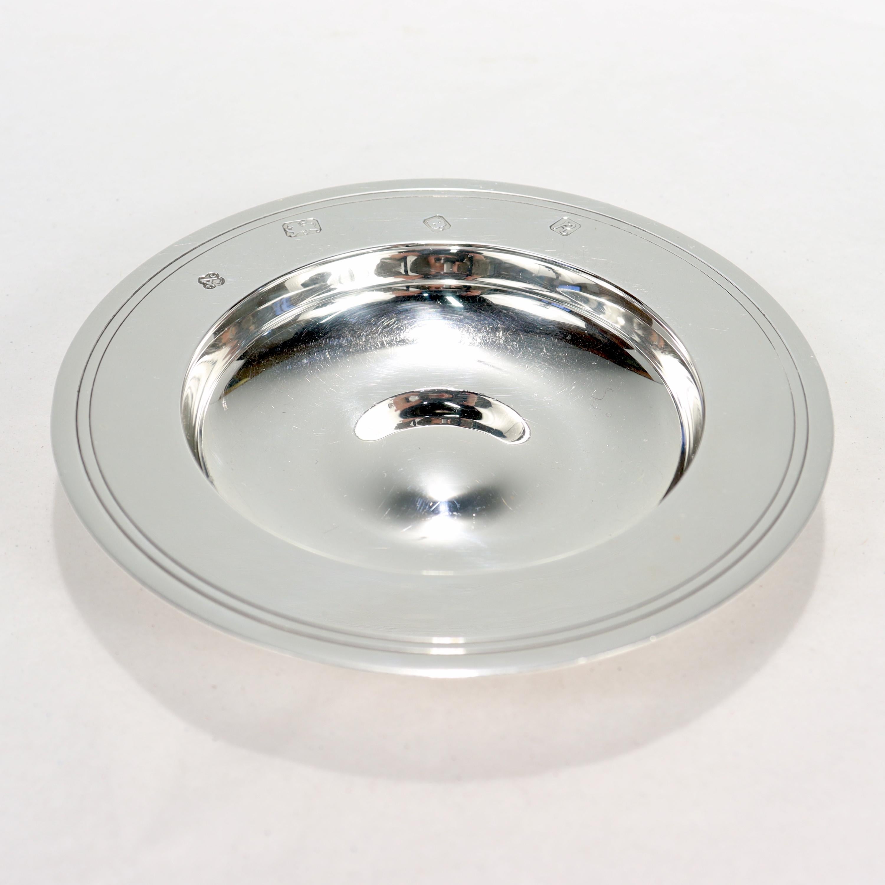A fine sterling silver dish or plate. 

By Asprey. 

In the Armada pattern.

With hallmarks for Asprey, Sterling, London, and 1991

Simply a great piece from Asprey!

Date:
1991

Overall Condition:
It is in overall good, as-pictured, used estate