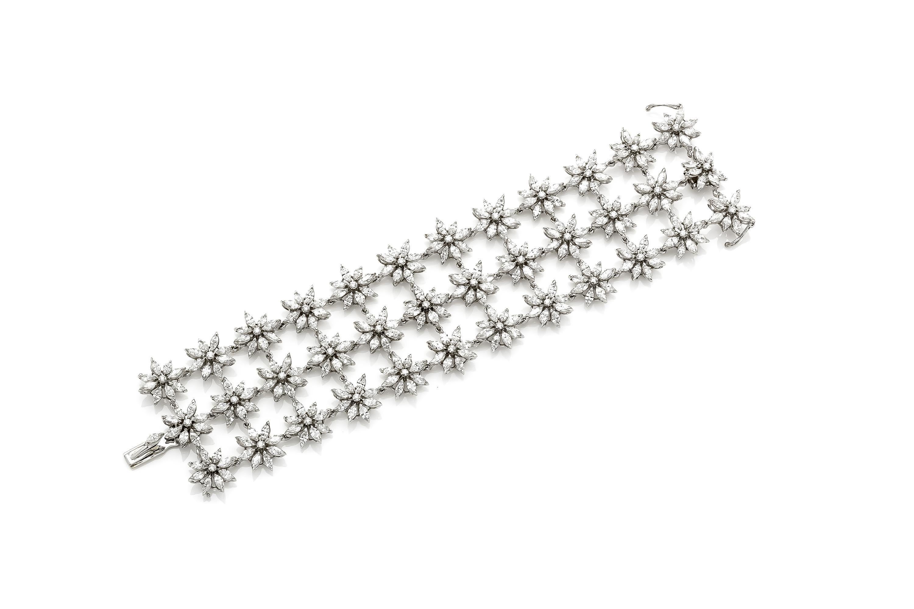Finely crafted in 18K white gold with Marquise and Round Brilliant cut Diamonds weighing a total of approximately 29.77 carats.
Signed by Asprey
Circa late 20th century
7 x 1 3/4 inches