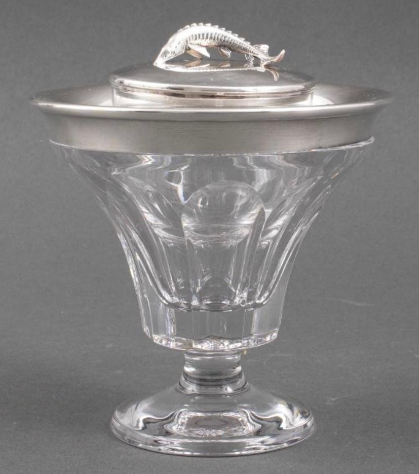 A classic entertaining piece by the re known firm of Asprey of London. The finial is of finely chased sterling and the top rim of the caviar server also has a nice wide sterling rim. Beautiful clear cut crystal and retaining its original box. Such a