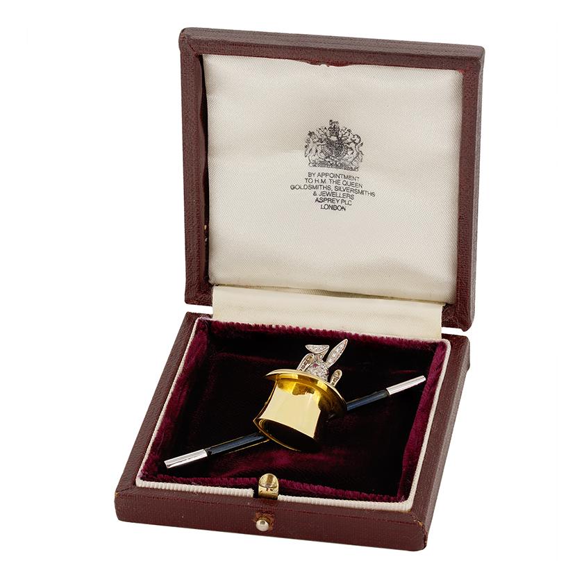 This delightful brooch comes from the designer Asprey. The whimsical design features a diamond set, 18 carat white gold rabbit emerging from a hat. The bunny sparkles with 0.60 carats of round brilliant diamonds, graded F in colour and VVS in