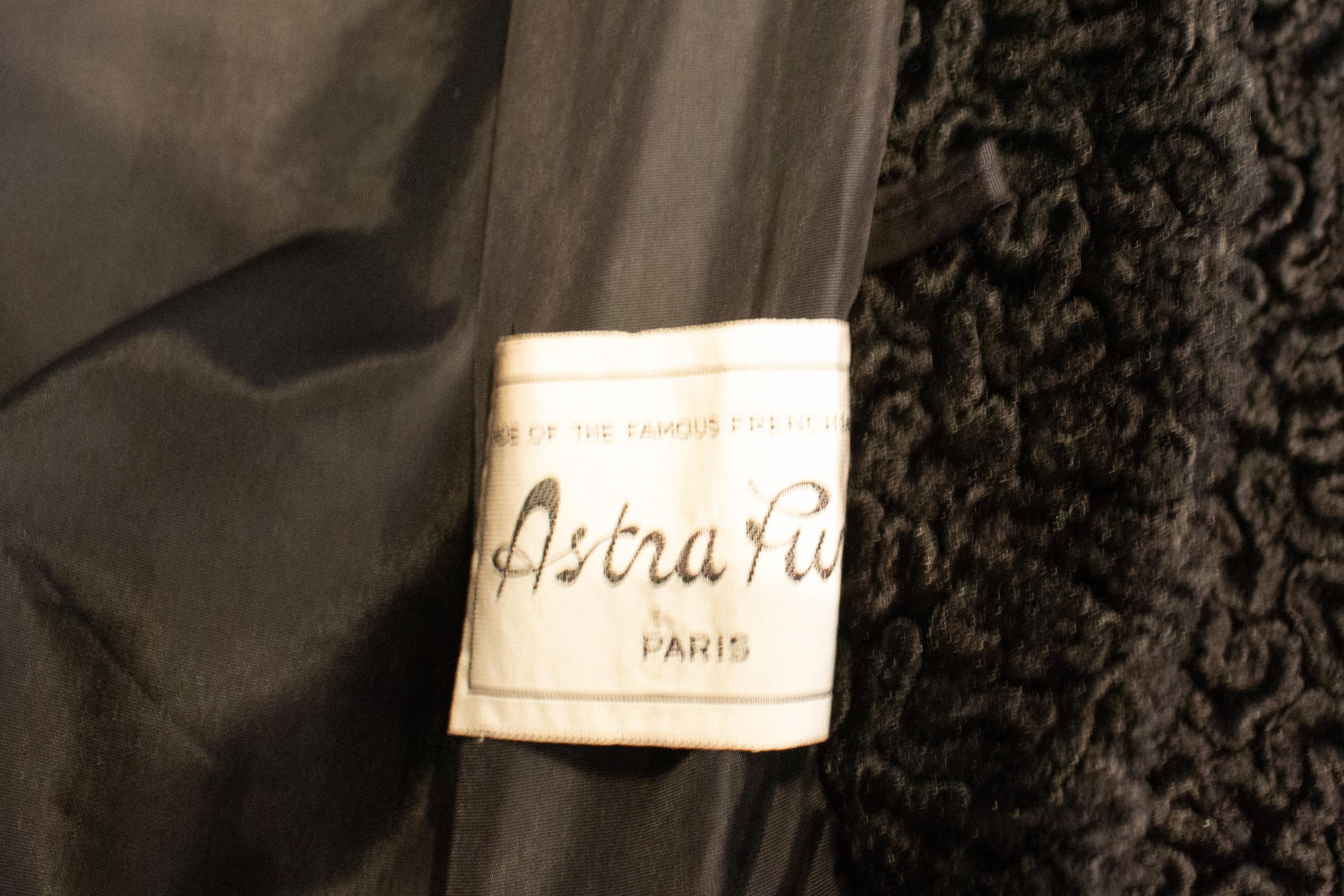 A chic vintage coat by Astrafurs Paris with a mink collar.  The coat has a wide collar and pocket on either side and is fully lined. Best worn loose, bust up to 44'',length 42''