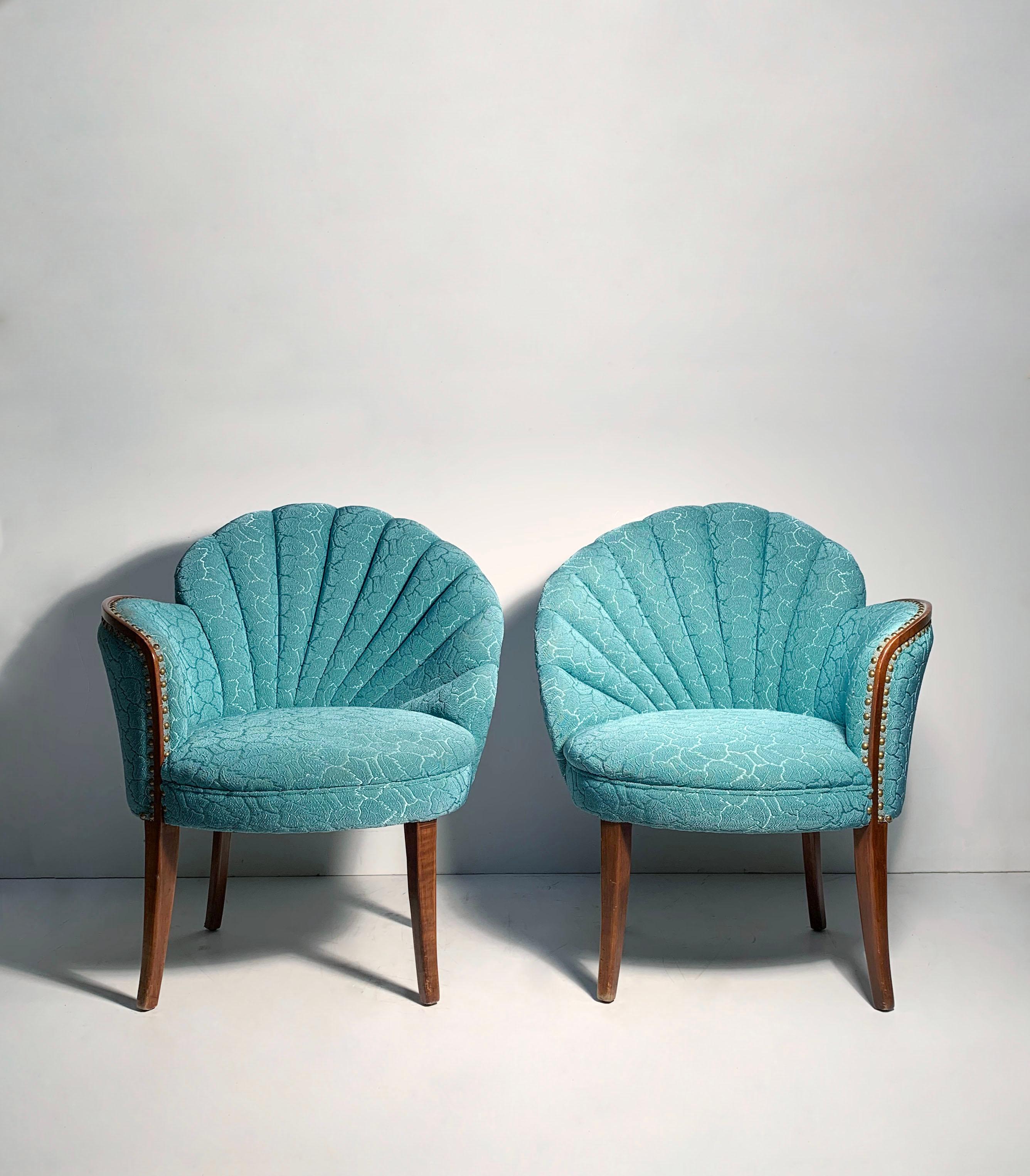 Glamour Pair of Vintage Asymmetrical Fan back chairs.

Original upholstery looks pretty nice. May want to have the undersides addressed though as it is vintage upholstery and there are some fabric staples used that may want to have removed.  Not a