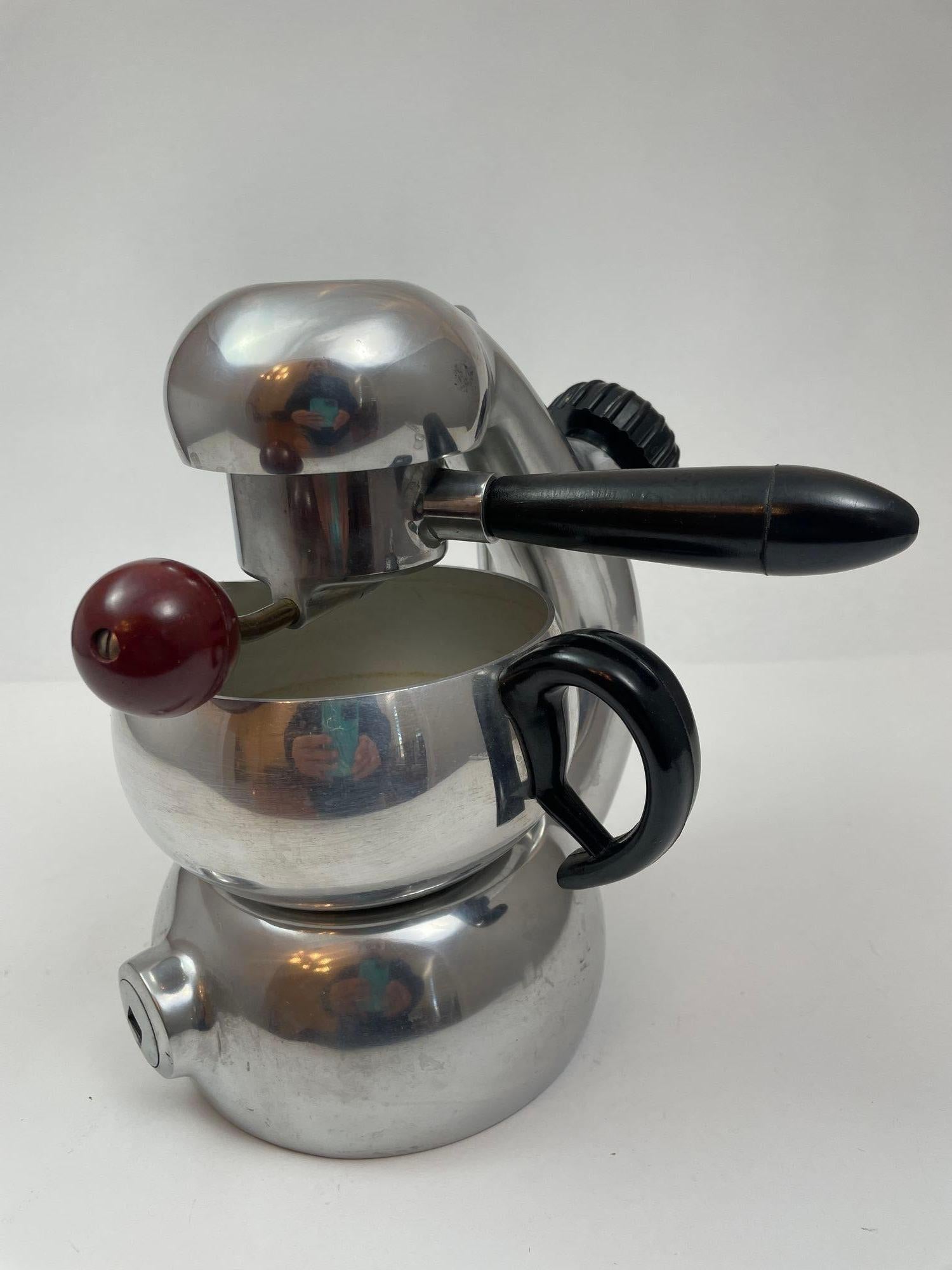 Vintage Giordano Robbiati's iconic Atomic coffee maker, originating from the 1950s, embodies a blend of vintage charm and robust functionality. Crafted with sleek curved lines and enduring mechanical prowess, this Brevetti Robbiati Milano creation