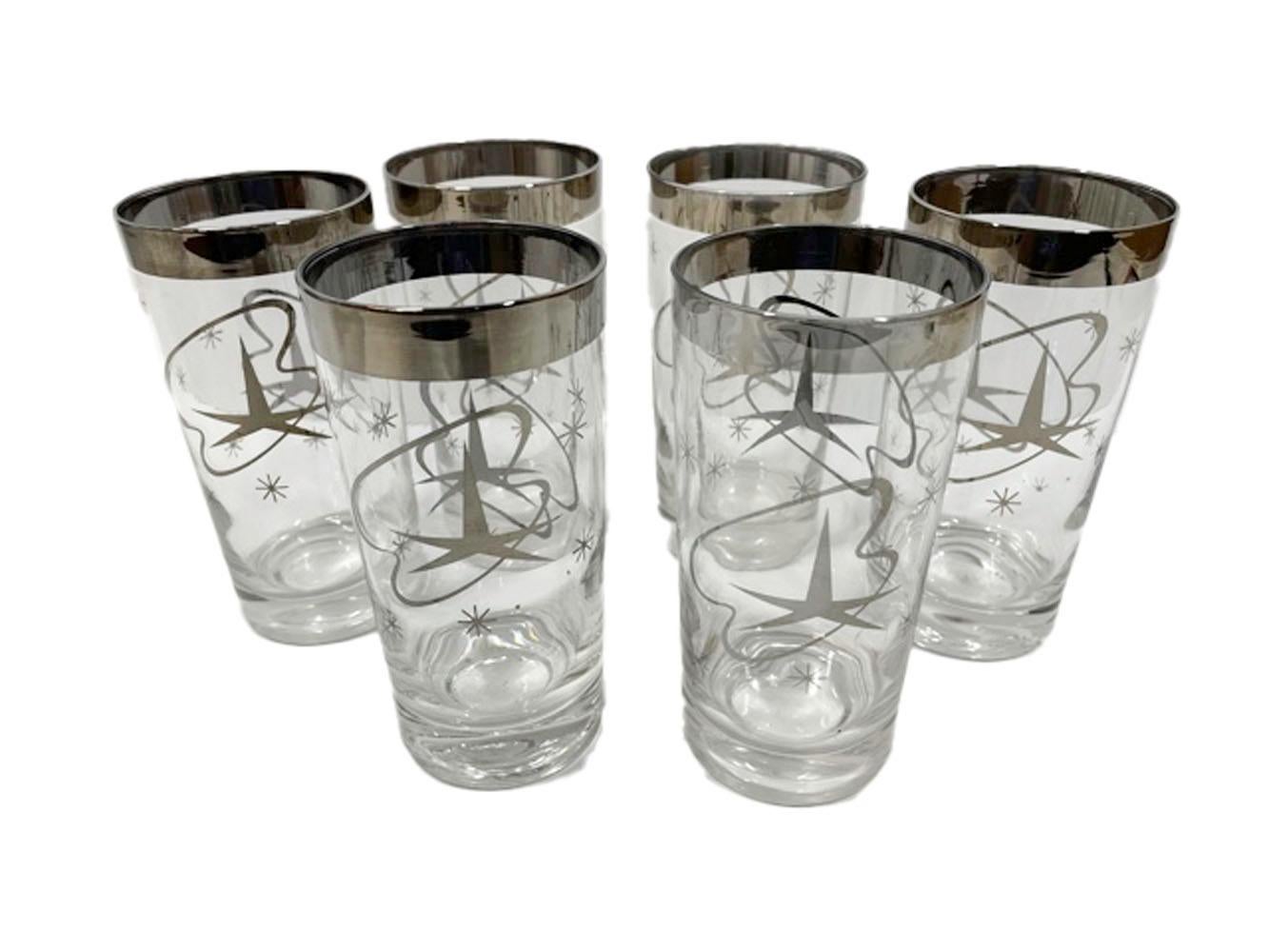 Set of six vintage silver decorated highball glasses having a wide band above a large atomic style star and amoeboid ribbon with scattered smaller stars.