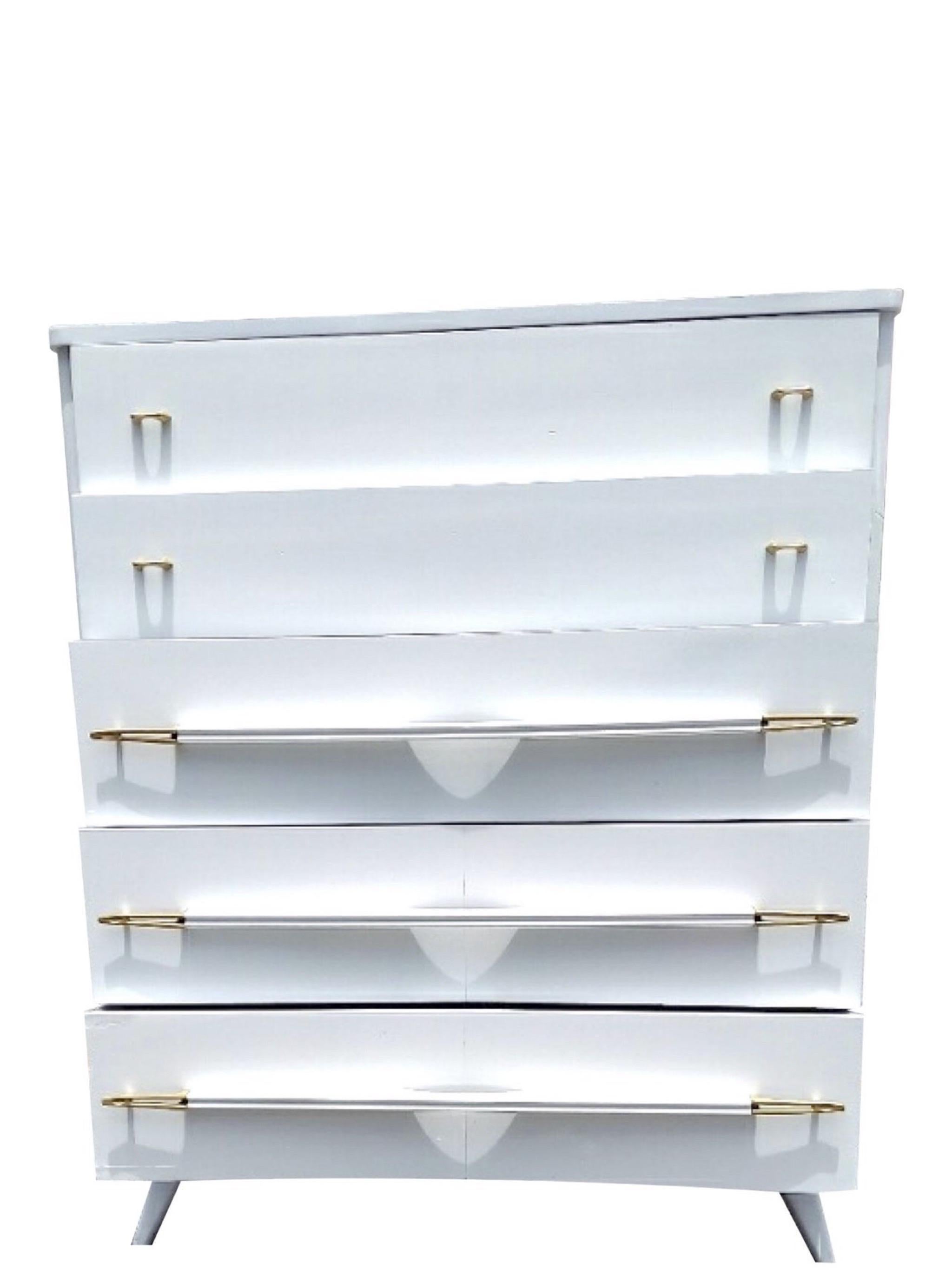 Vintage Atomic White Lacquered With Brass Highboy
Funky splayed legs, 5 drawers with wooden handles that have the most interesting brass accents. The top drawers have brass pulls and it all just pops against the high gloss white lacquer. I am