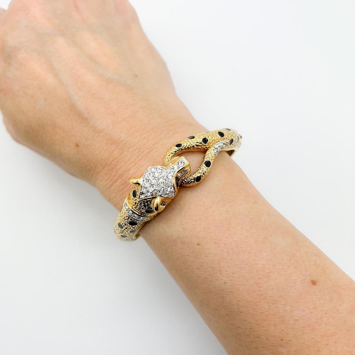 Our vintage Attwood & Sawyer Big Cat Cuff. One of the most glamourous big cat cuffs around. This one by the English jewellery company Attwood & Sawyer boasts exceptional craftmanship with lustrous gold plate punctuated with glossy black enamel. Pave